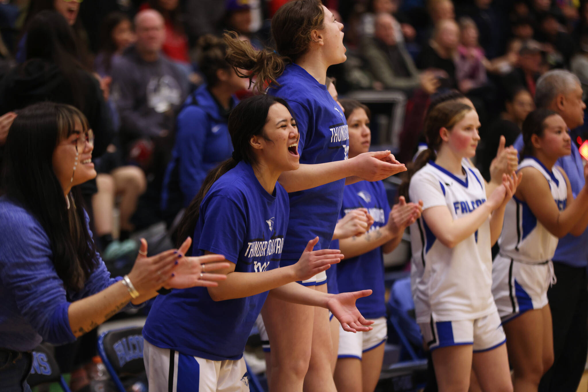 The TMHS bench reacts to a foul call late in a Tuesday night home win against JDHS. The final seconds of the game gave them plenty of reason to cheer as TMHS was able to complete a narrow comeback victory. (Ben Hohenstatt / Juneau Empire)