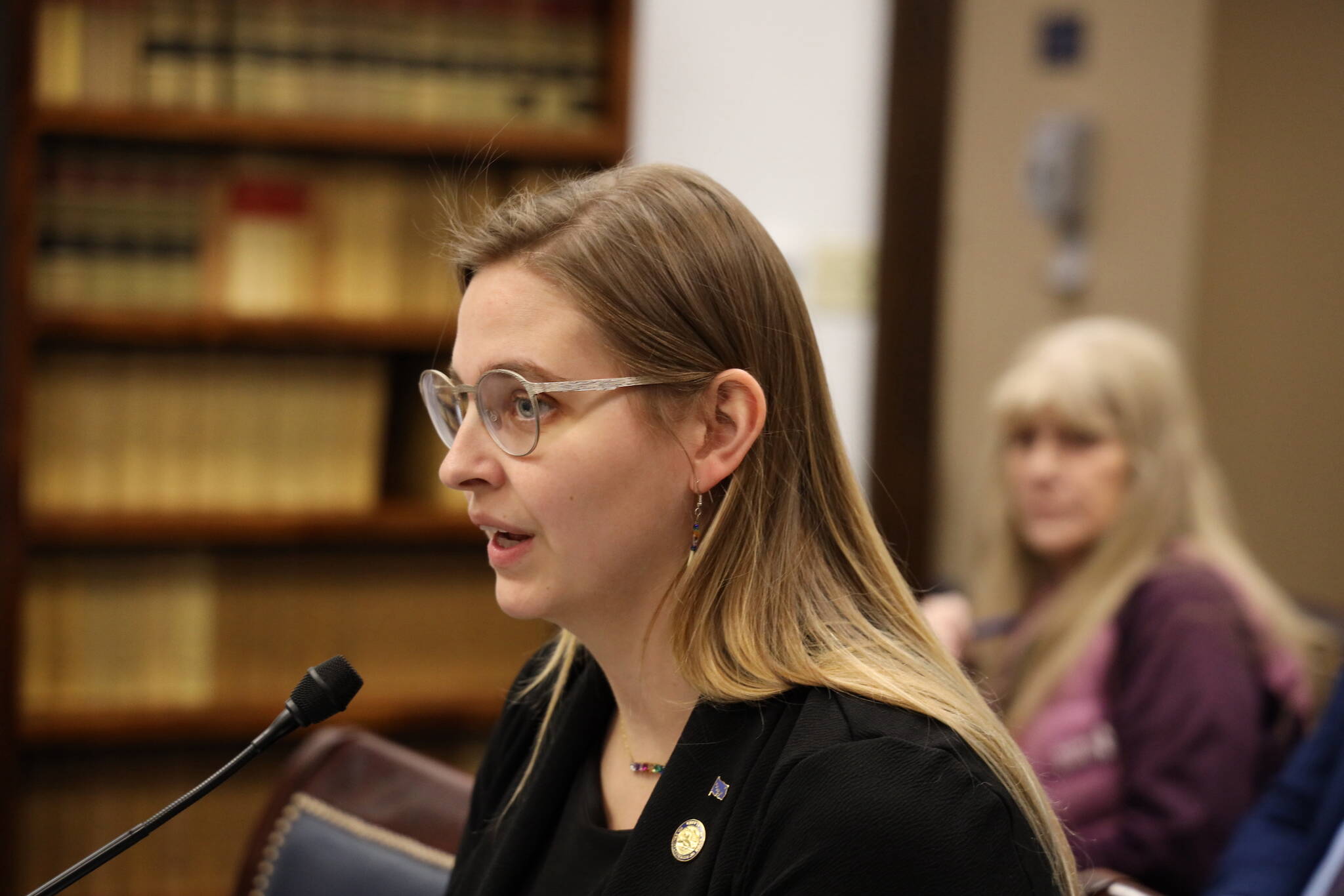 Rep. Ashley Carrick, D-Fairbanks, speaks to the House State Affairs Committee Thursday afternoon about a bill seeking to allow for any e-bikes to be a part of the generally recognized three-tier classifications of e-bikes to ride anywhere a regular bike would be allowed. (Clarise Larson / Juneau Empire)