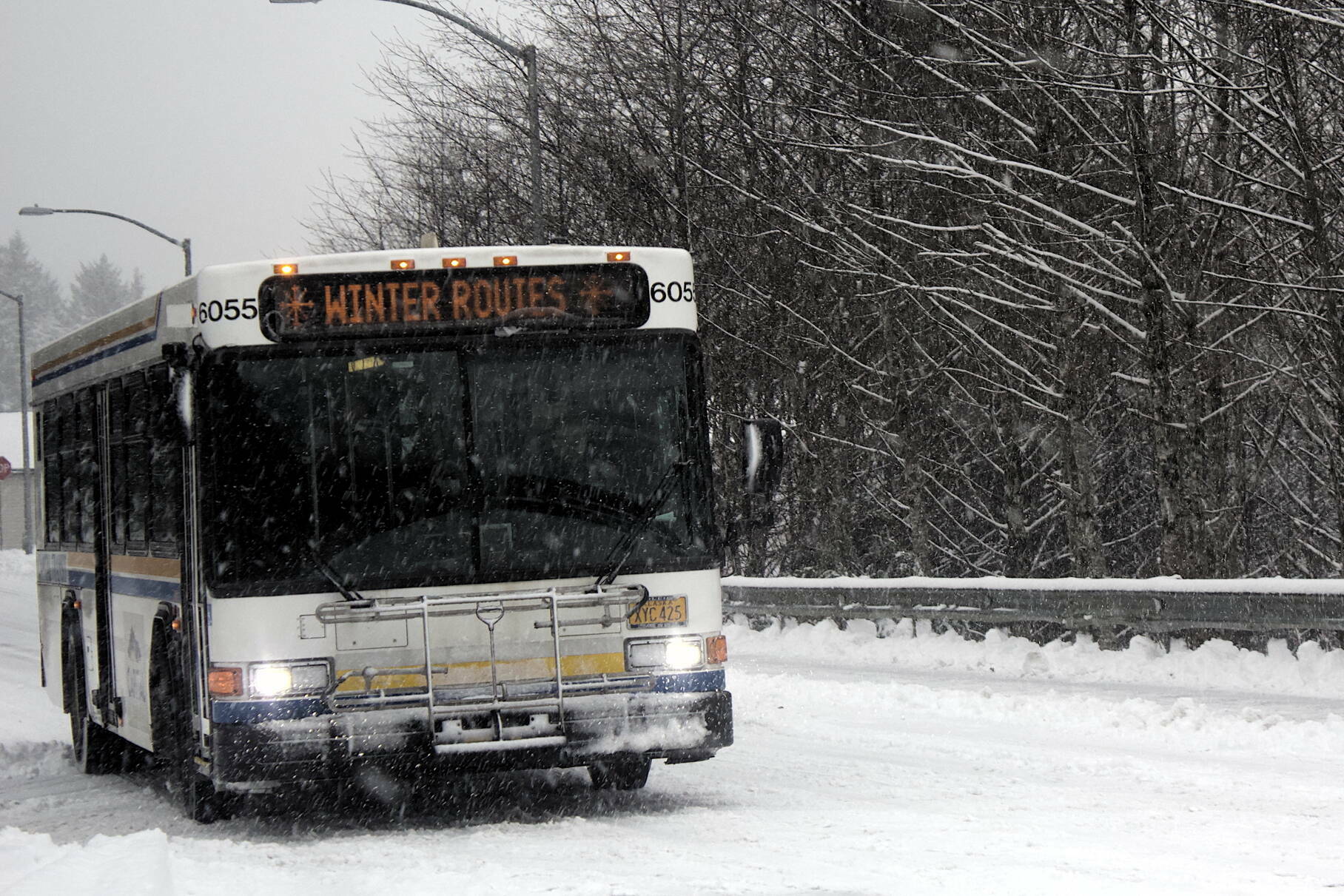 A Capital Transit bus approaches a stop near the SEARHC Ethel Lund Medical Center on a snowy day. (Mark Sabbatini / Juneau Empire File)