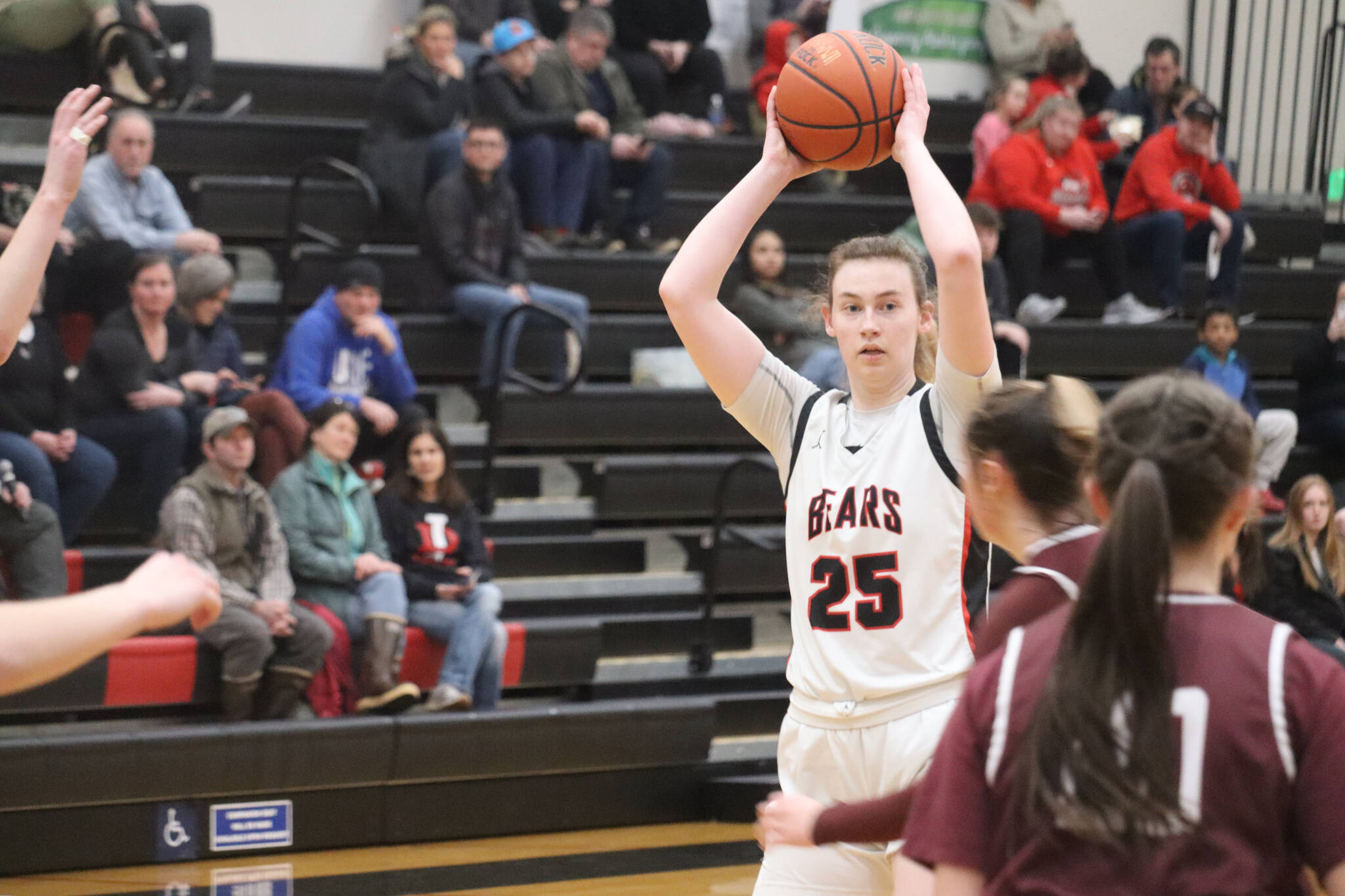 JDHS senior Ashley Laudert, who scored 4 points on Friday and 9 on Saturday against Ketchikan High School, looks for an open pass during Friday’s home conference game facing the Lady Knights. (Jonson Kuhn / Juneau Empire)