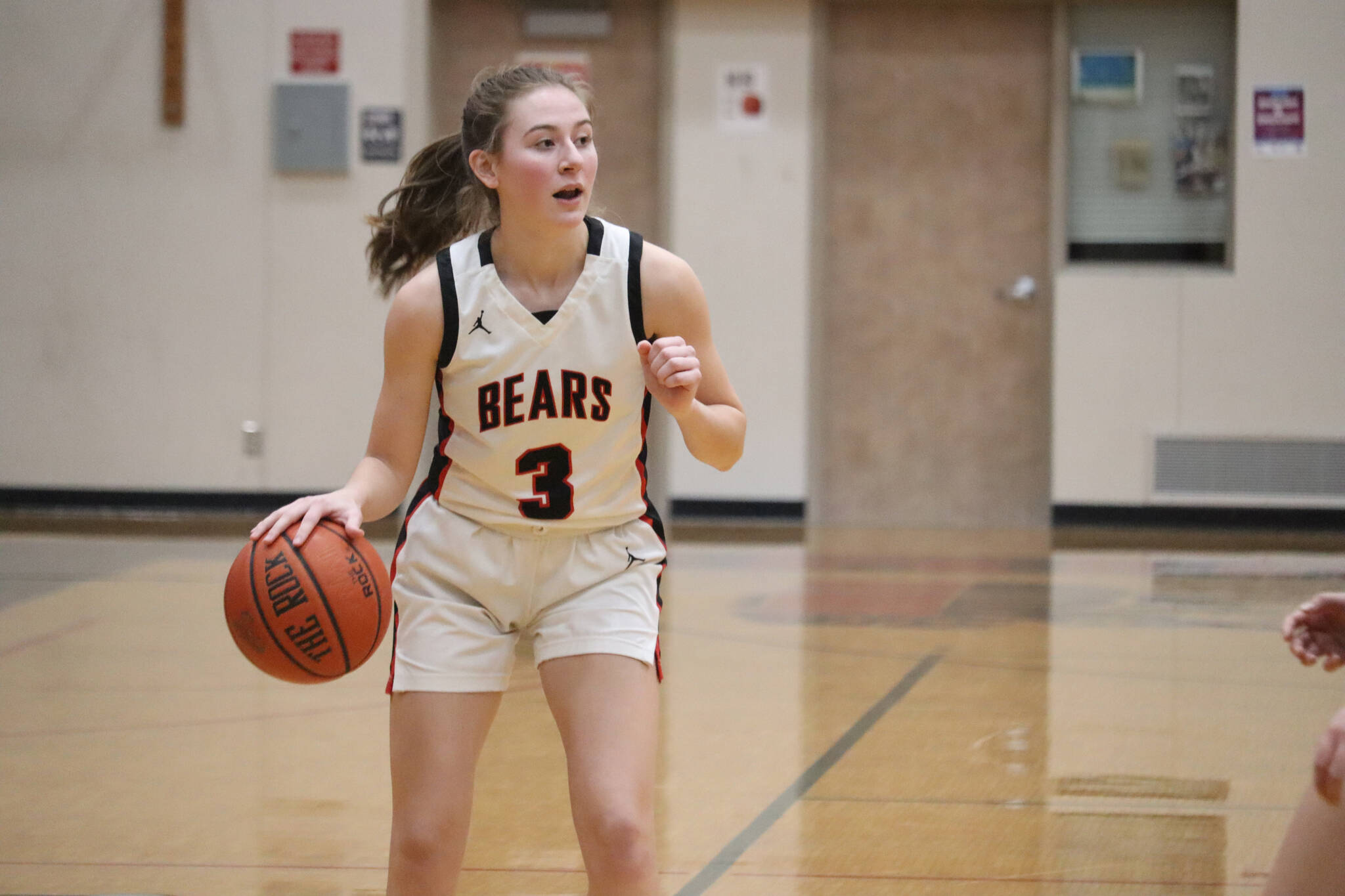 JDHS senior Carlynn Casperson takes the ball down court on Saturday against Ketchikan during an at home conference game. Casperson would hit her first 3-point shot of the season during the third quarter, helping her team secure the win against the Lady Knights. (Jonson Kuhn / Juneau Empire)