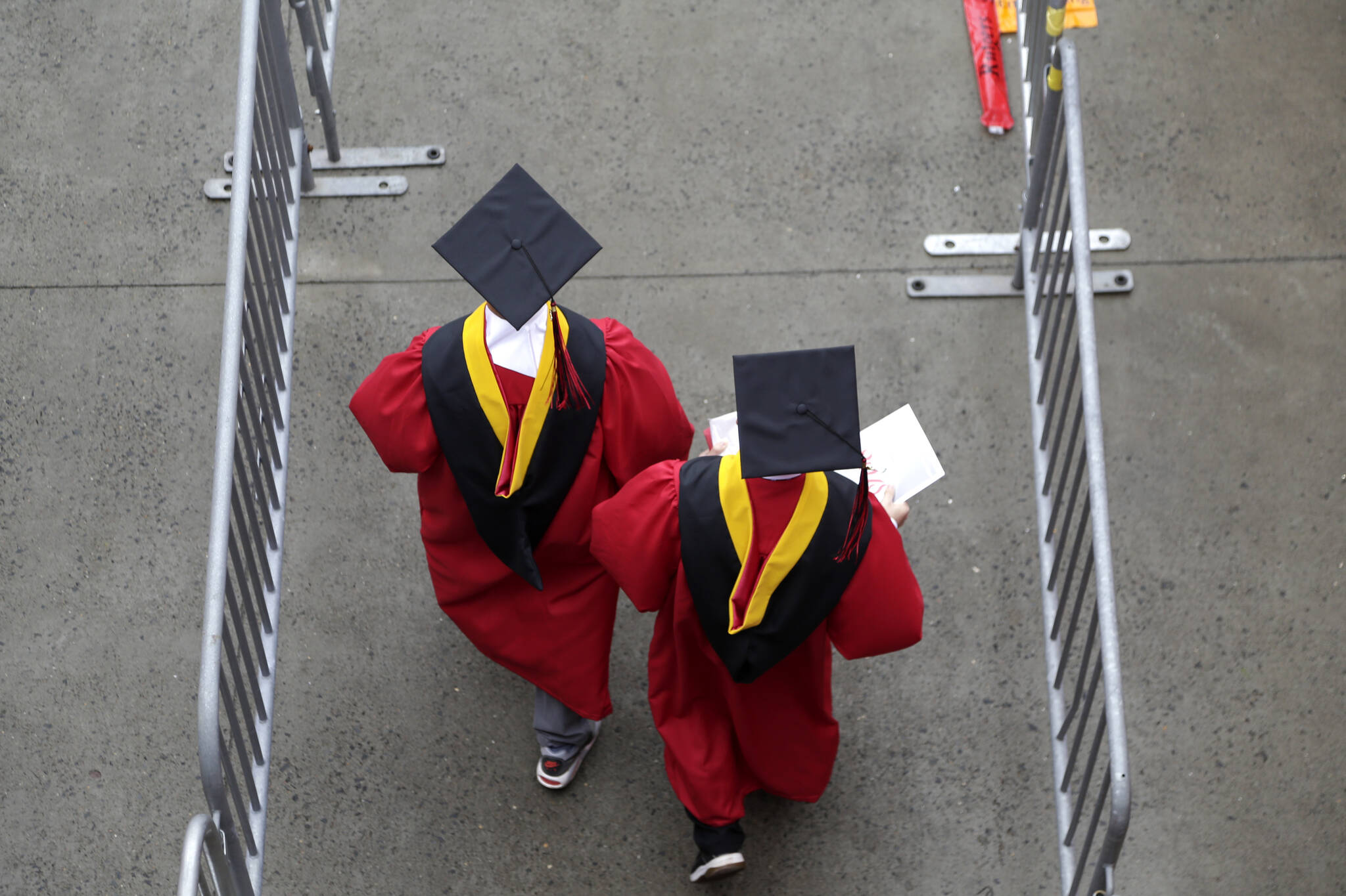 New graduates walk into the High Point Solutions Stadium before the start of the Rutgers University graduation ceremony in Piscataway Township, N.J., on May 13, 2018. The Supreme Court is about to hear arguments over President Joe Biden’s student debt relief plan. It’s a plan that impacts millions of borrowers who could see their loans wiped away or reduced. (AP Photo / Seth Wenig)