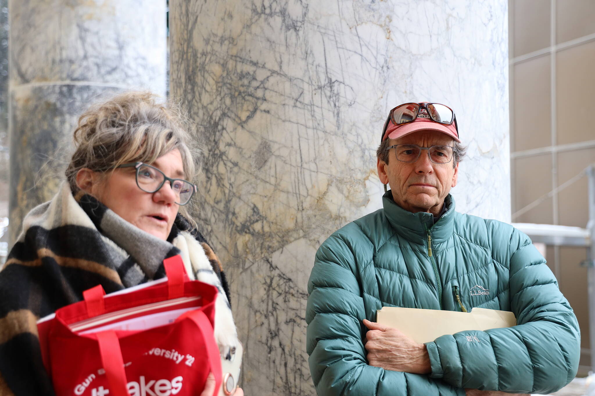 Tamara Kruse and Frank Rue, volunteers with Moms Demand Action, discuss their meetings about proposed gun safety legislation with state lawmakers at the Alaska State Capitol on Tuesday. (Clarise Larson / Juneau Empire)