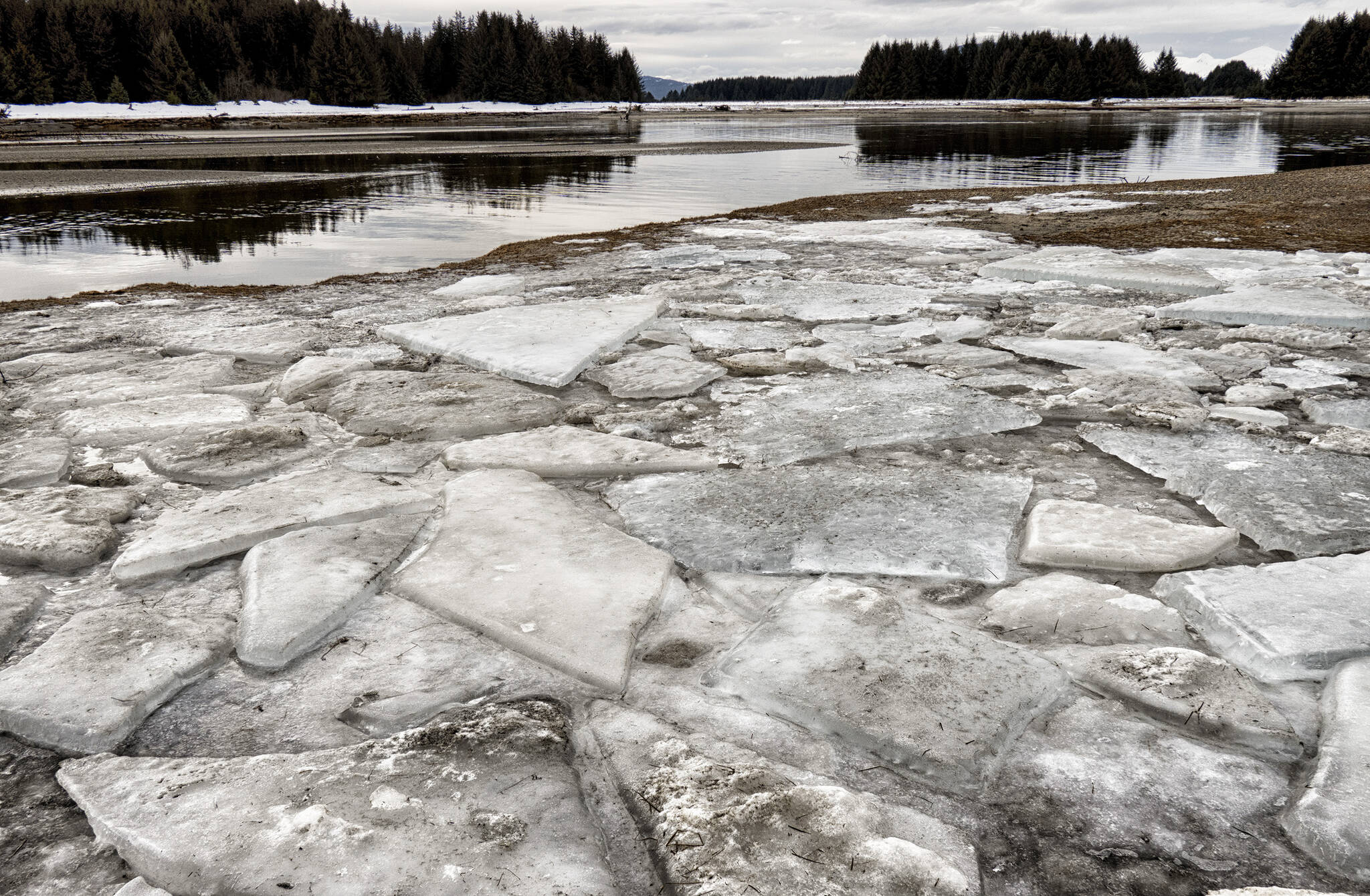 Tide shatters ice layer on Eagle River. (Courtesy Photo / Kenneth Gill, gillfoto)