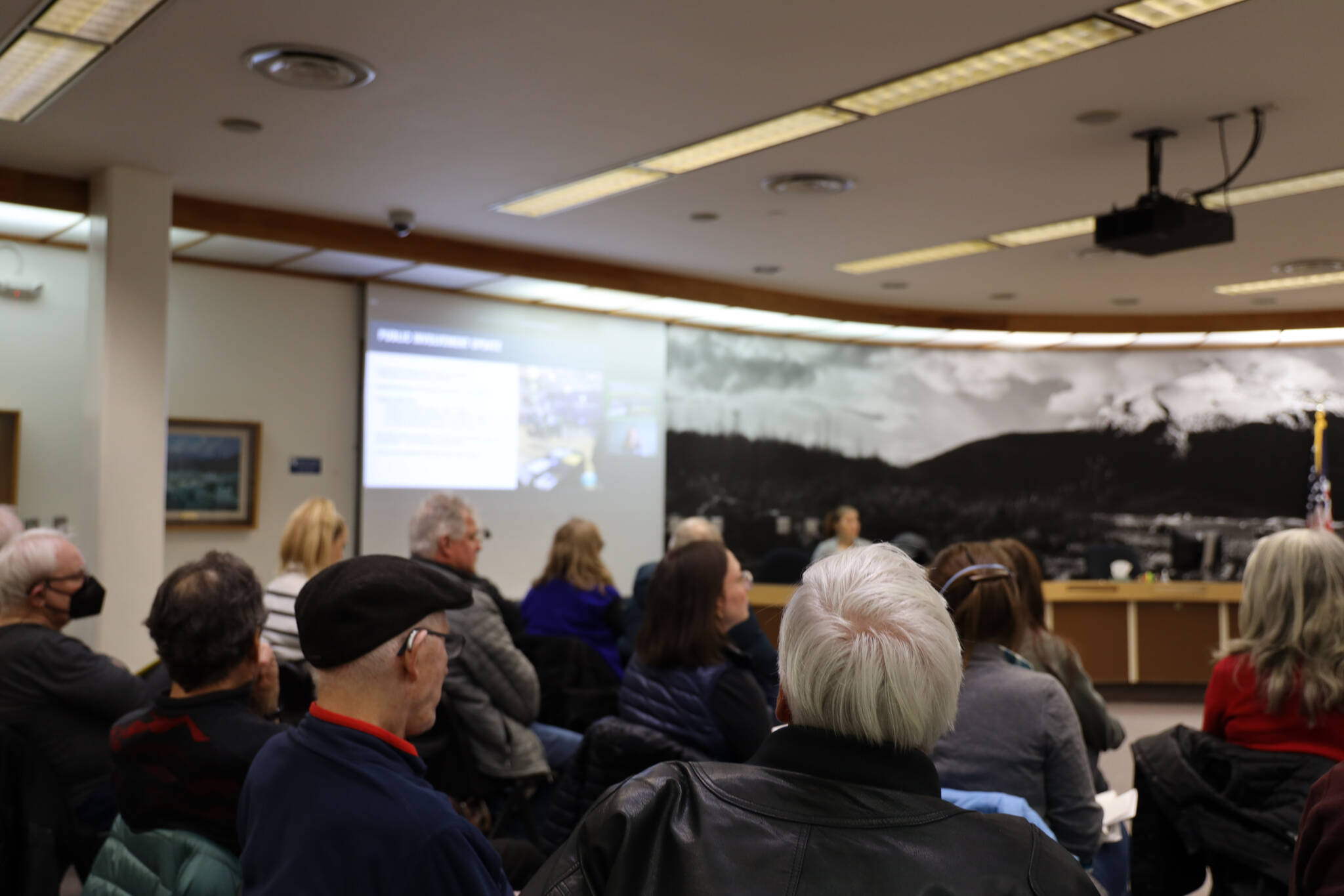 Residents listen to a presentation during an open forum meeting hosted by the City and Borough of Juneau Public Works and Facilities Committee Thursday evening to discuss a proposed second crossing from Juneau to Douglas Island. (Clarise Larson / Juneau Empire)