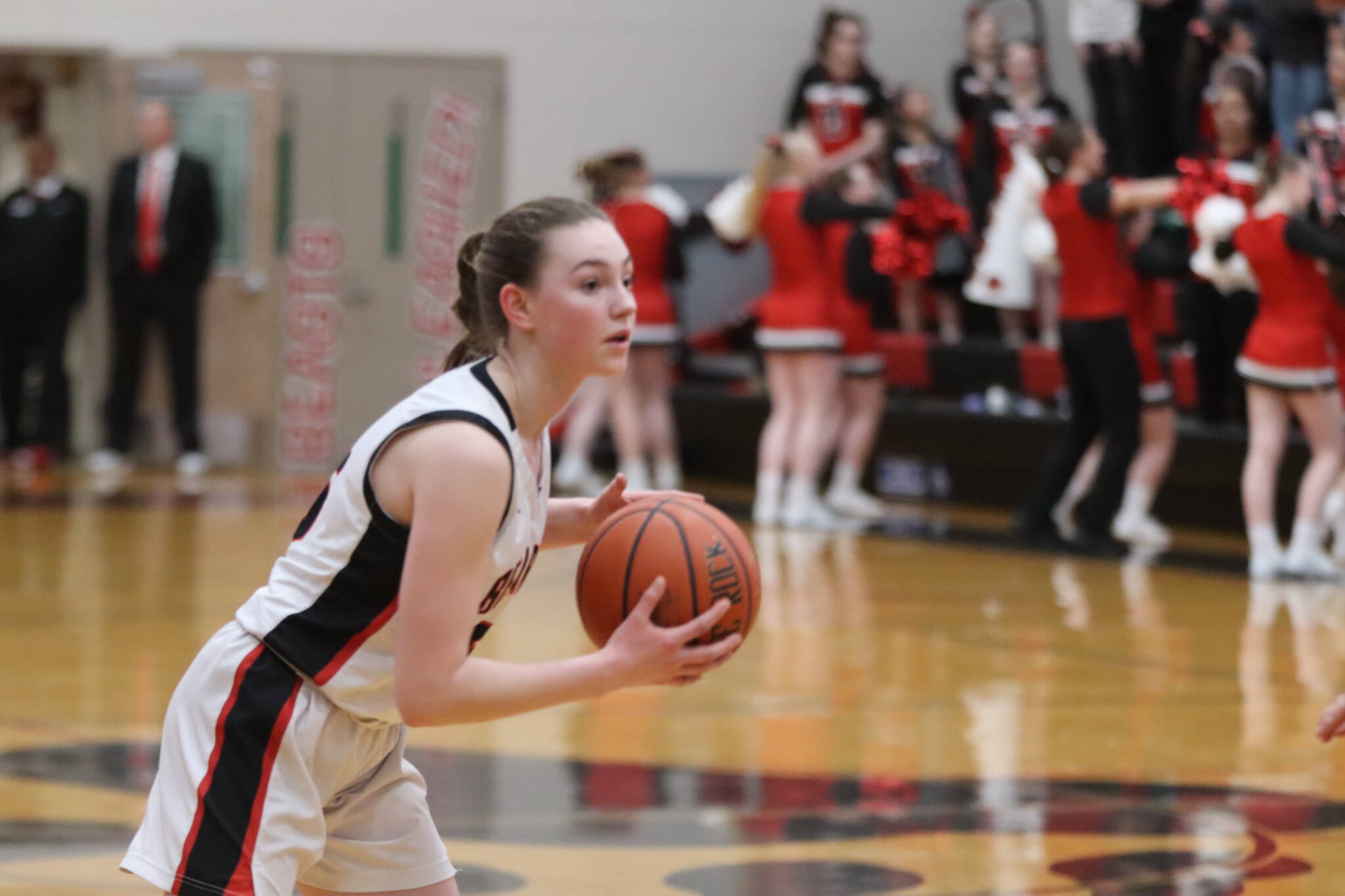 Jonson Kuhn / Juneau Empire
JDHS freshman Gwen Nizich looks for an open pass down court on Thursday night’s game against TMHS. Nizich led the Crimson Bears in scoring for a total of 13 points.