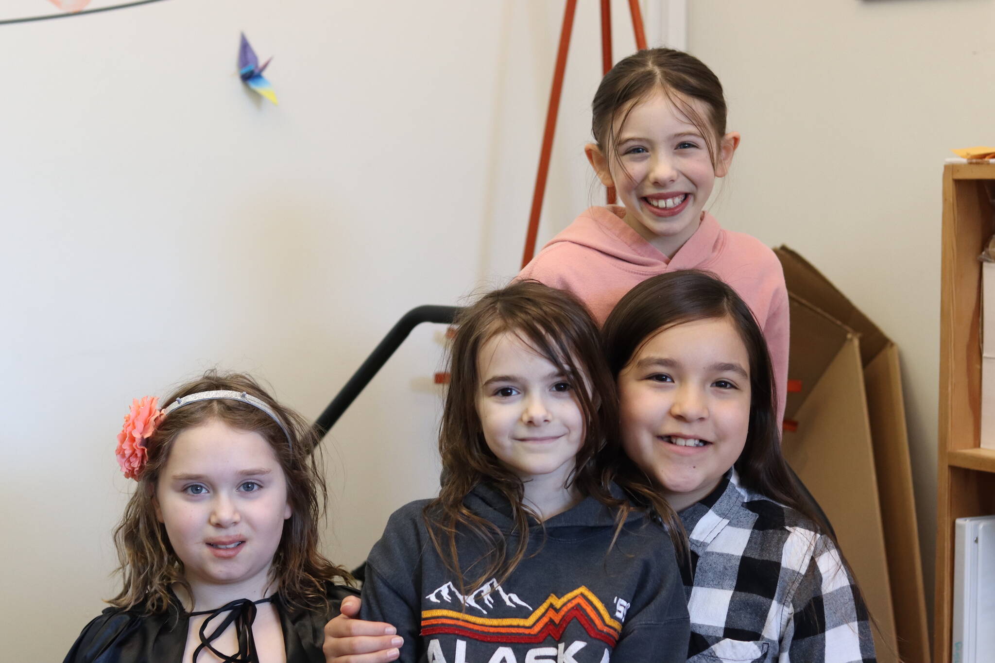 Left to right, Lilah Gaguine, Maddie Lesh, Lyndley Nakamura and Hallie Reid (top) are all smiles after taking 10th place in this year’s Battle of the Books competition on Thursday at Borealis Elementary School via phone conference. (Jonson Kuhn / Juneau Empire)