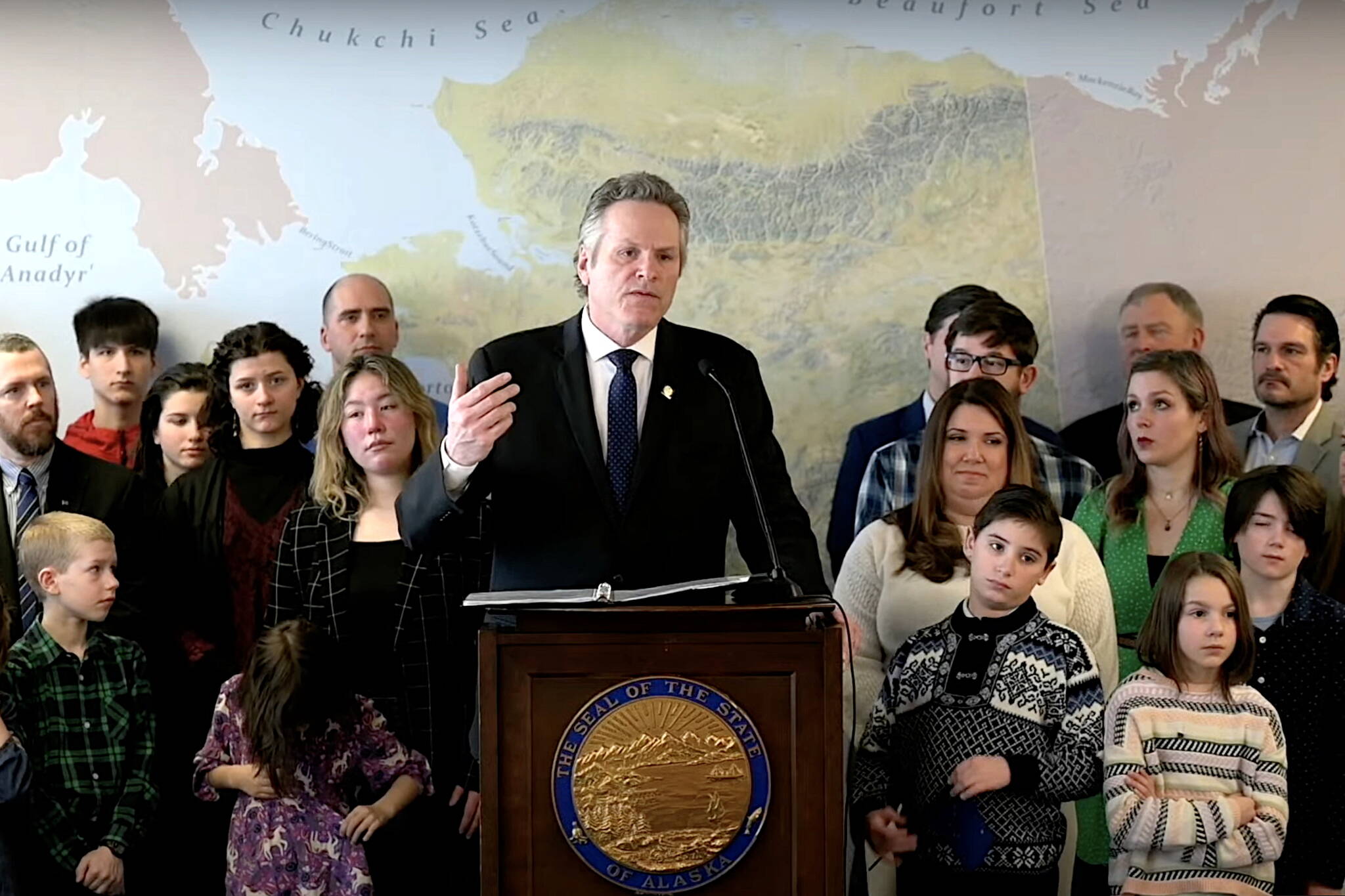 Screenshot from official livestream 
Gov. Mike Dunleavy unveils proposals to offer public school teachers annual retention bonuses and enact policies similar so-called “don’t say gay” laws in states such as Florida during a press conference in Anchorage on Tuesday.