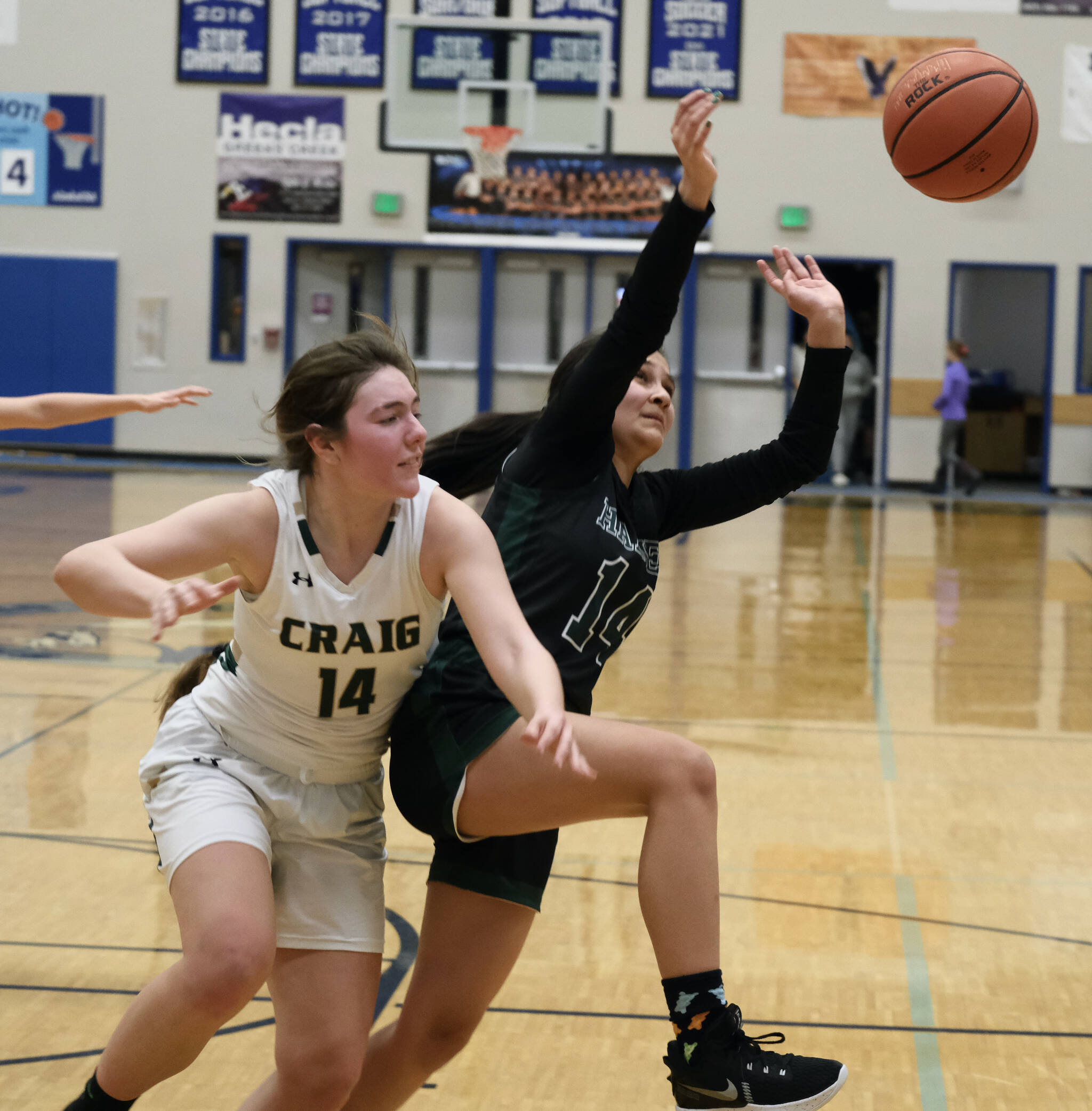 Craig’s Alissa Durgan and Haines’ Alison Benda chase a rebound during the Region V tournament on Wednesday. (Klas Stolpe / For the Juneau Empire)