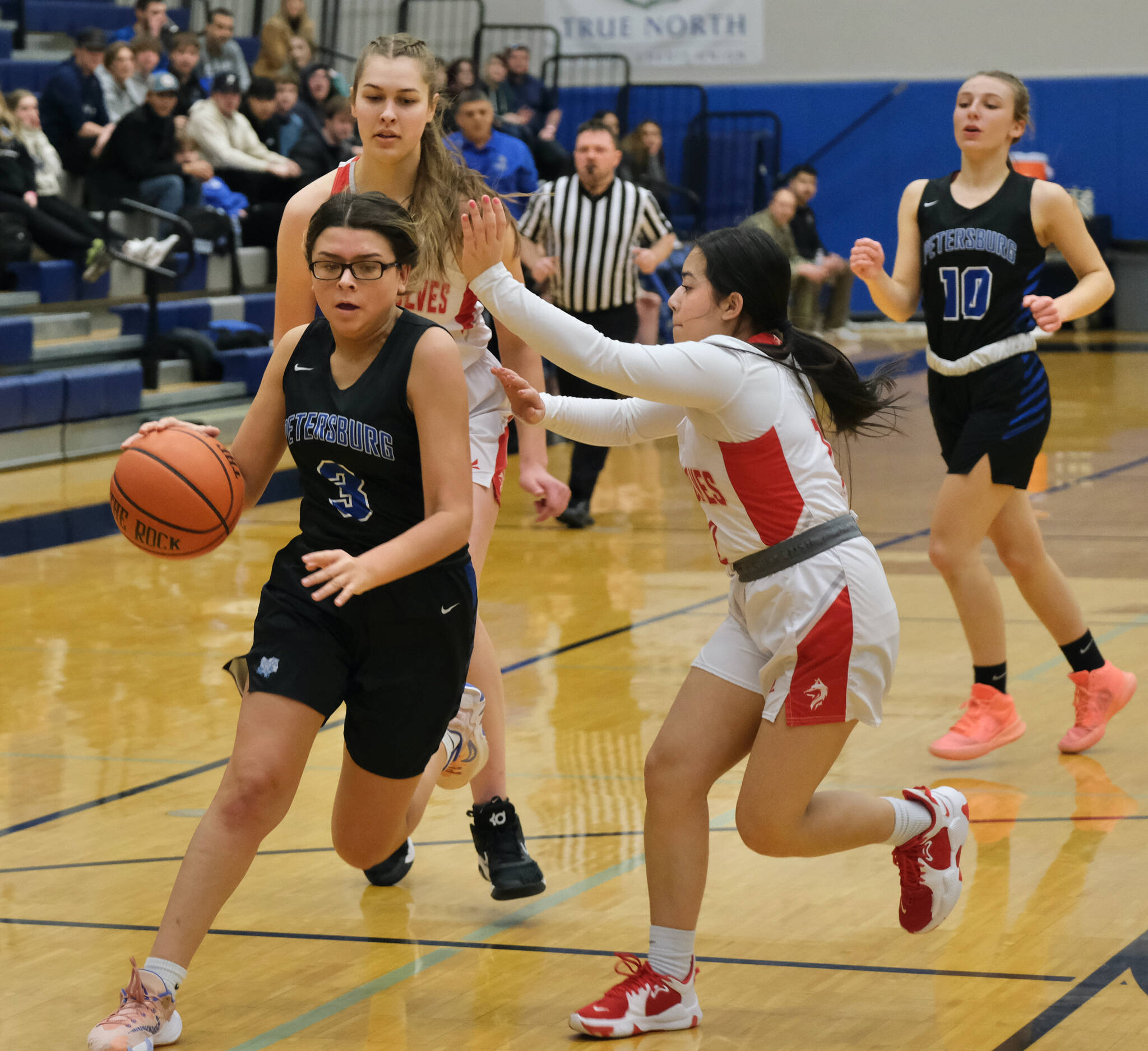 Petersburg’s Kasiah Lopez (3) drives against Wrangell’s Christina Johnson during the Region V tournament on Wednesday. (Klas Stolpe / For the Juneau Empire)