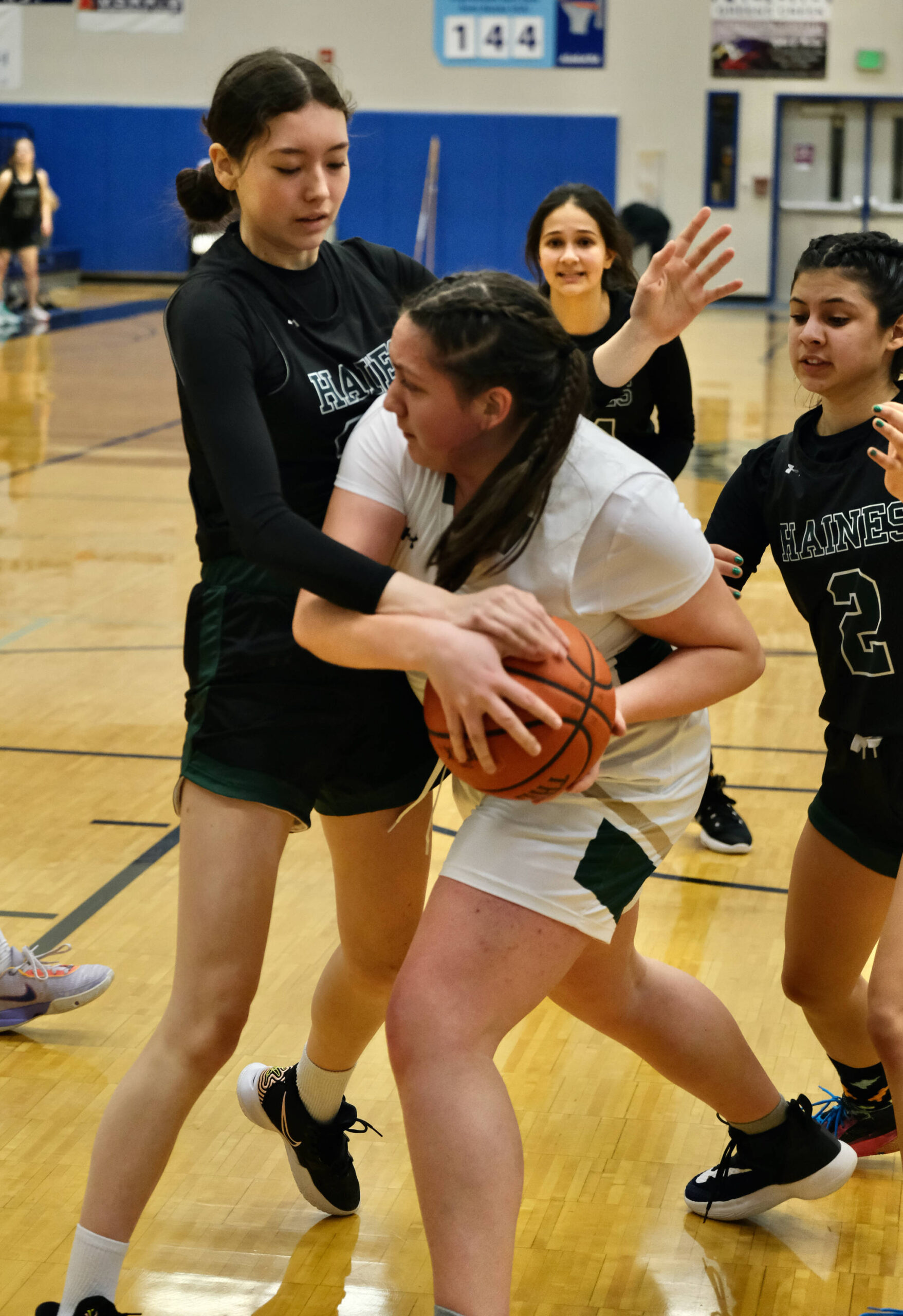 Craig’s Priscilla Trudeau protects the ball from Haines’ Raven Hotch and Grace Long Godinez during Region V tournament action on Wednesday. (Klas Stolpe / For the Juneau Empire)