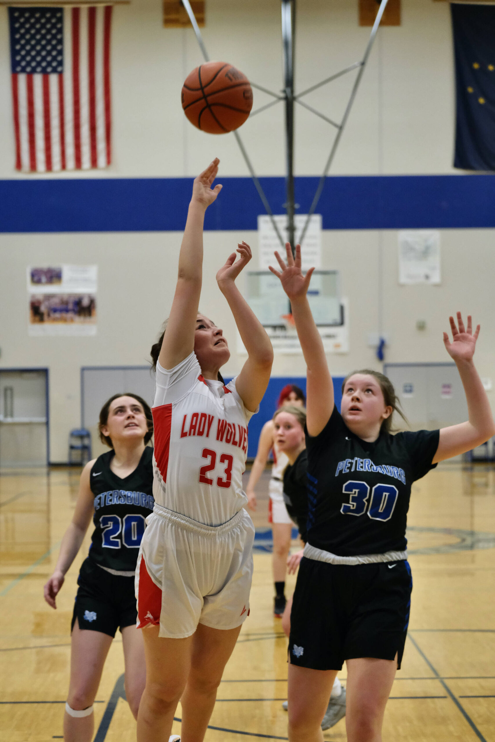 Wrangell High School junior Kayla Meissner (23) Petersburg High School sophomore Kylie Mattingly (30) during the Lady Wolves’ 48-10 win over the Lady Vikings in the Region V 2A/4A Basketball Tournament on Wednesday at Thunder Mountain High School in Juneau. (Klas Stolpe for the Juneau Empire)
