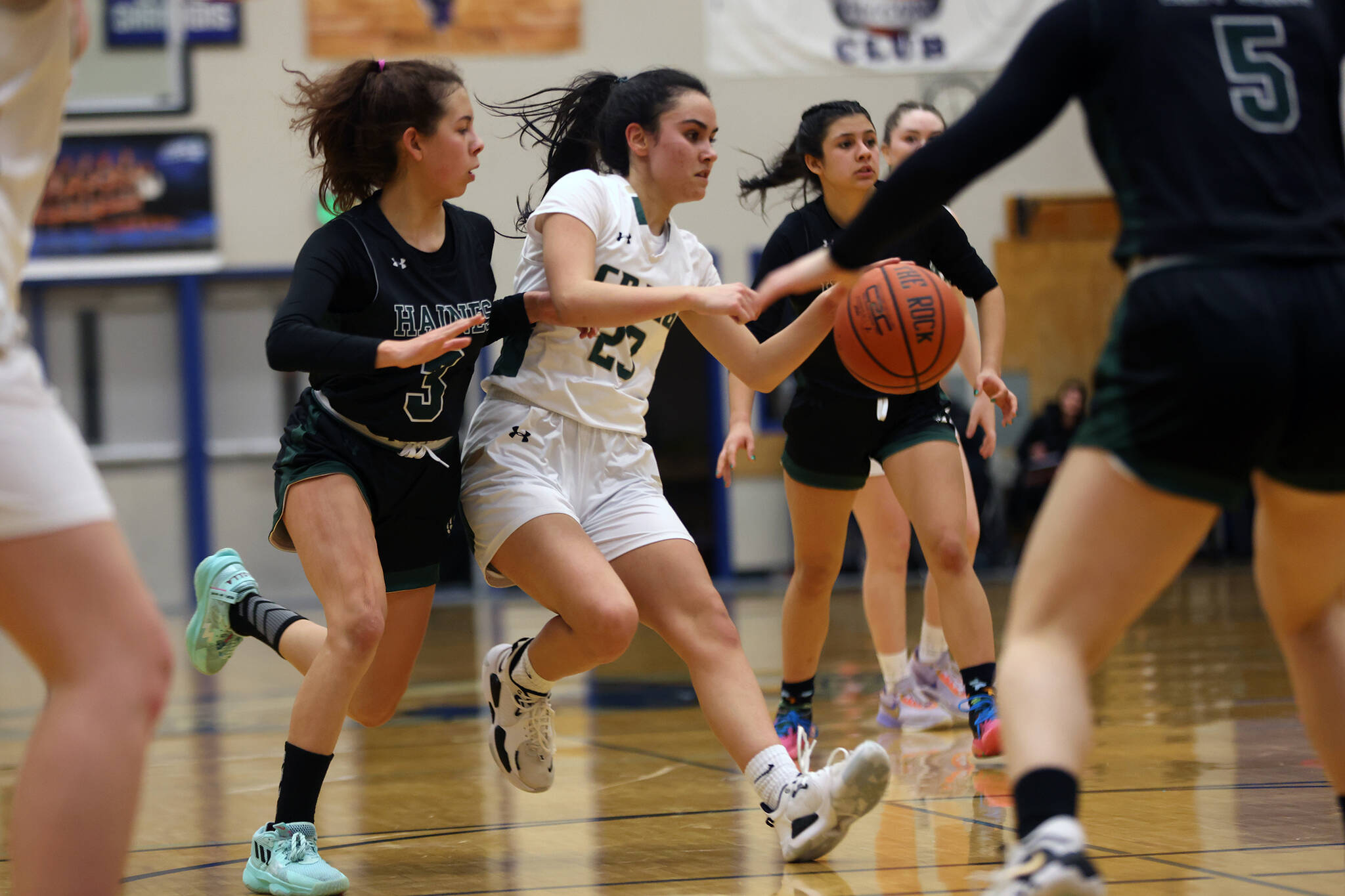 Craig senior Alexis Lawnicki (23) darts through the Haines defense during the second half of a Region V 2A Tournament game at Thunder Mountain High School in Juneau. Lawnicki made layups and sank free throws late that helped put the game away for Craig. (Ben Hohenstatt / Juneau Empire)
