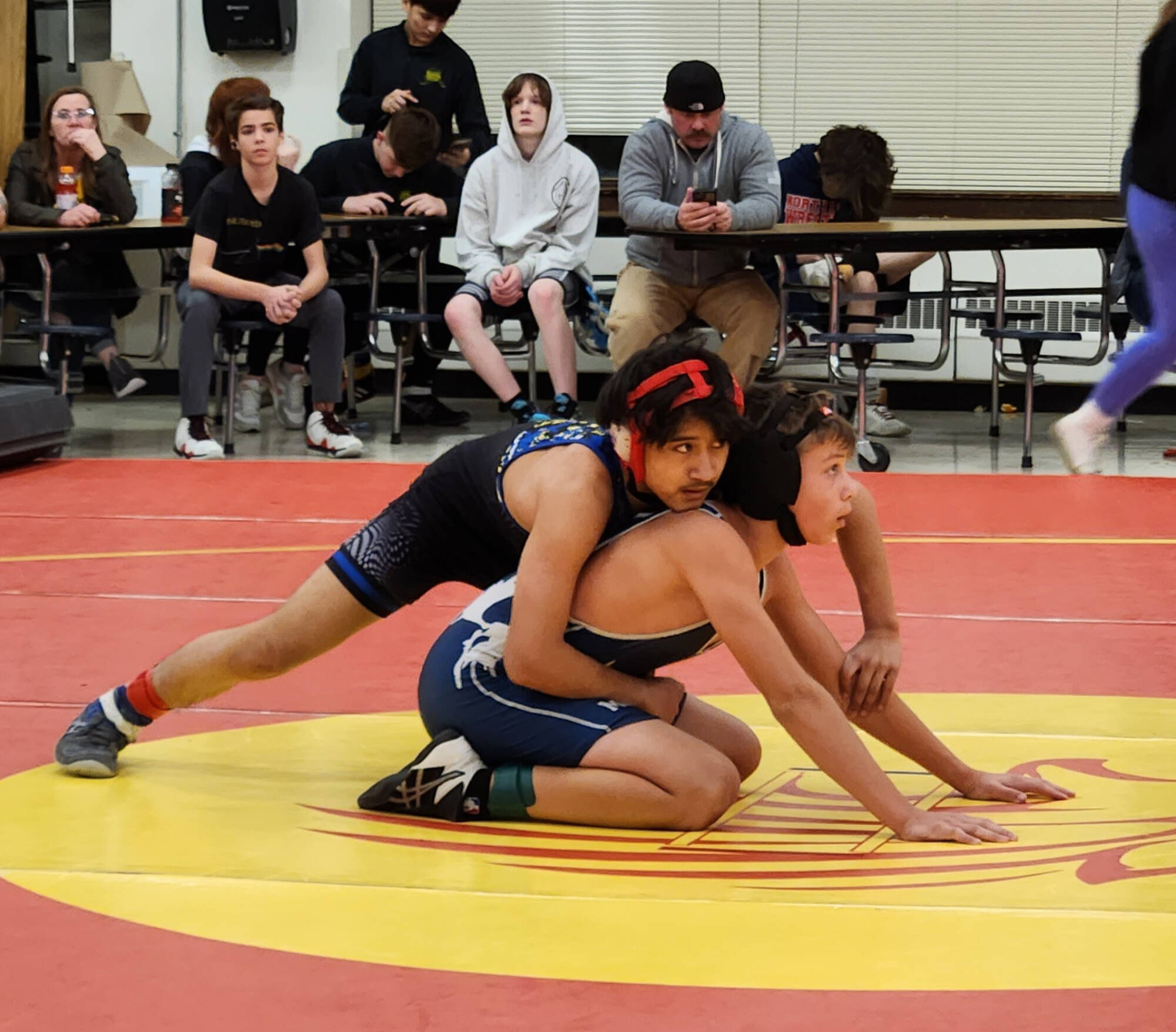 Emanual Canales Ortiz of the Juneau Youth Wrestling Club prepares for second period against Dawson Folcik of Palmer on March 3-4 in Fairbanks. (Courtesy Photo / Melinda Messmer)