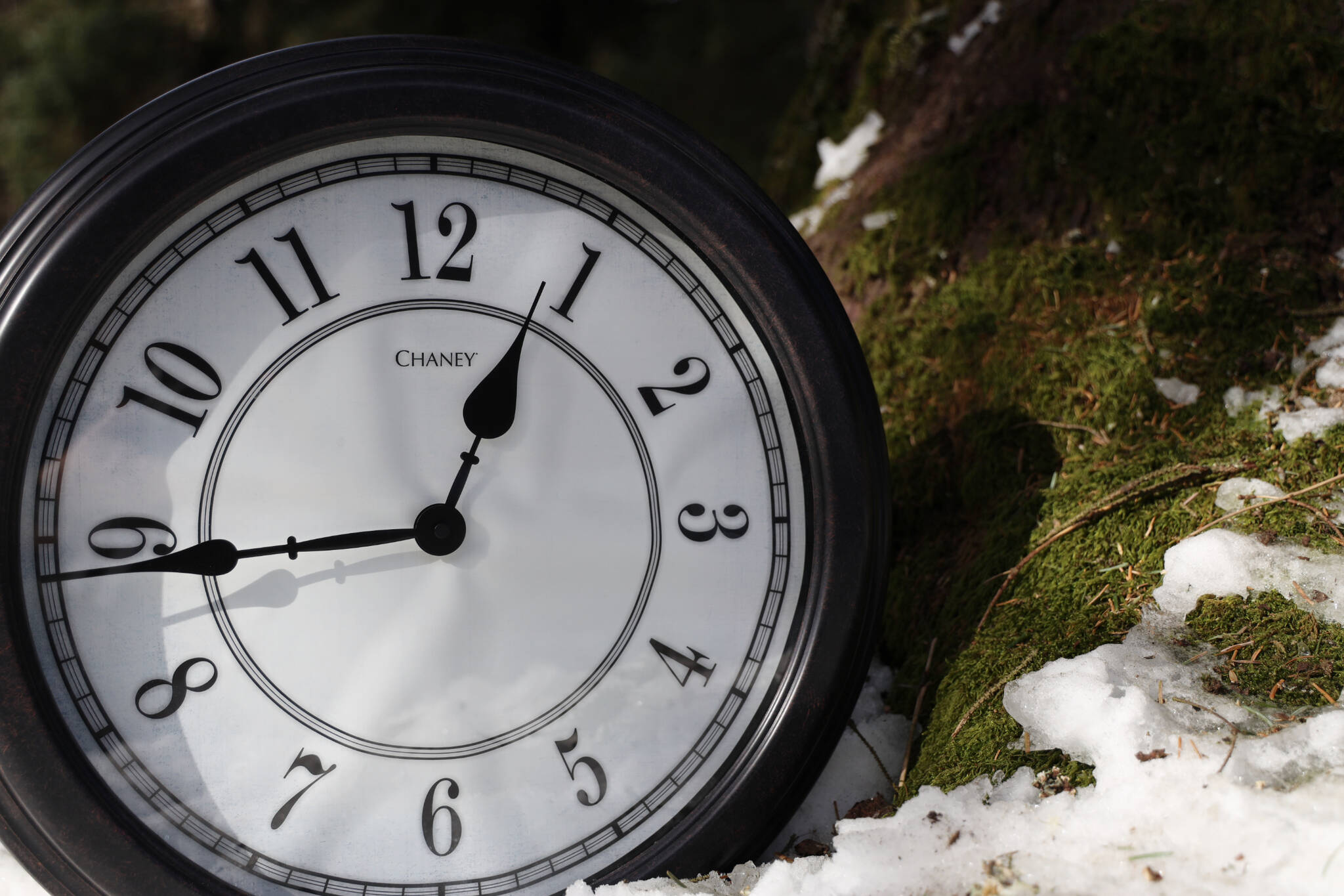 The sun beams down on a clock and nearby melting snow. A bill that calls for Alaska to choose to remain in Daylight Saving Time for the entirety of the year and say farewell to the switch to Standard Time has been reintroduced to the Alaska Legislature this session. (Clarise Larson / Juneau Empire File)