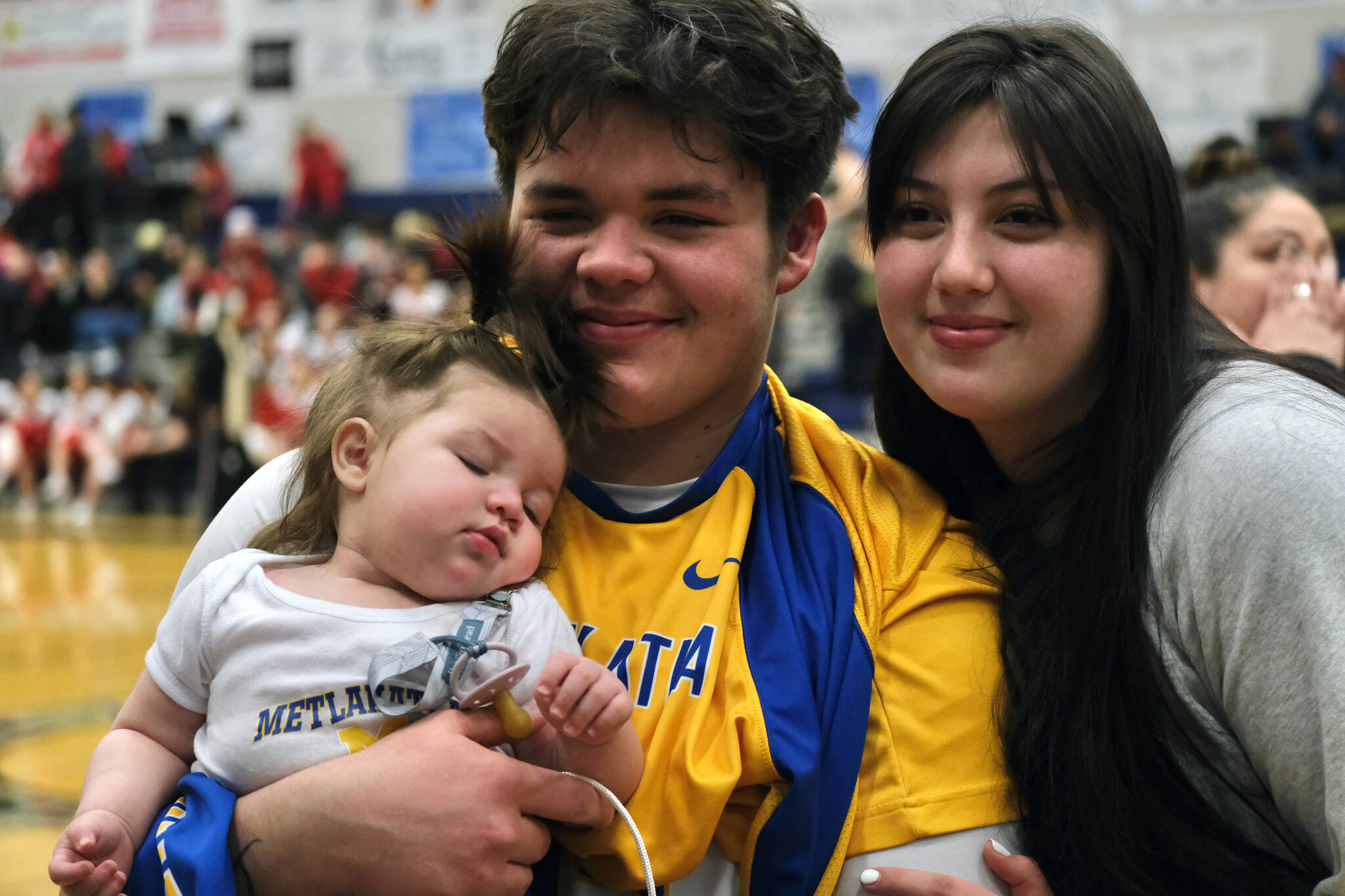 Metlakatla senior Cameron Gaube and Samantha Marsden pose with infant daughter Paris after the Chiefs won the Region V Championship over Petersburg on Friday. (Klas Stolpe / For Juneau Empire)
Metlakatla senior Cameron Gaube and Samantha Marsden pose with infant daughter Paris after the Chiefs won the Region V Championship over Petersburg on Friday. (Klas Stolpe / For Juneau Empire)