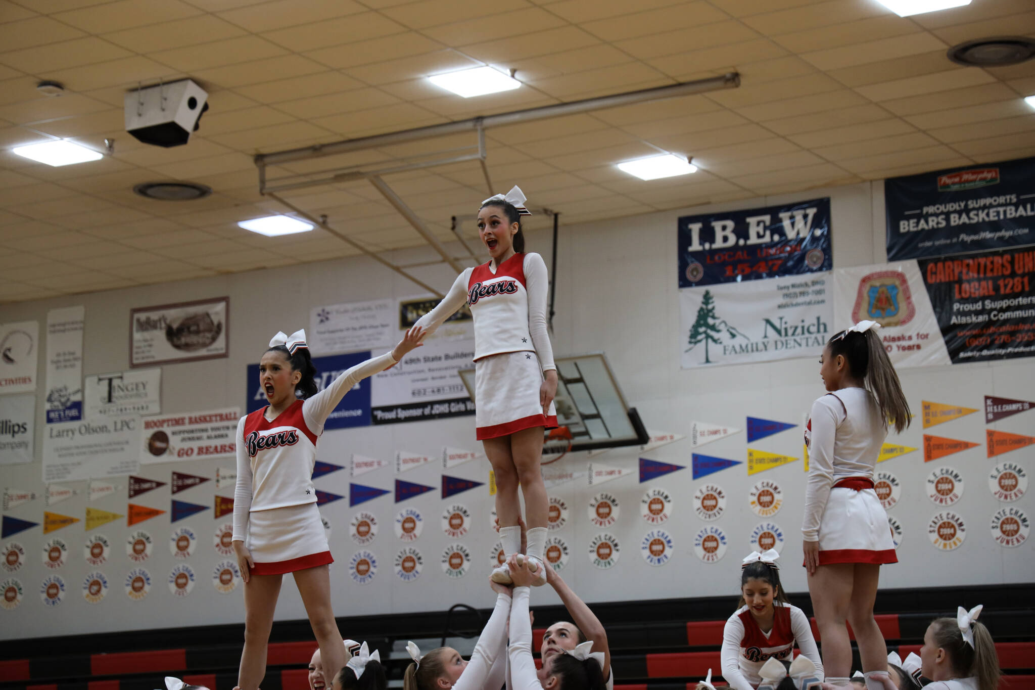 JDHS cheerleaders balance in the air with ease during the annual Region V 2A/4A dance adjudication competition hosted at Juneau-Douglas High School:Yadaa.at Kalé Saturday afternoon. (Clarise Larson / Juneau Empire)