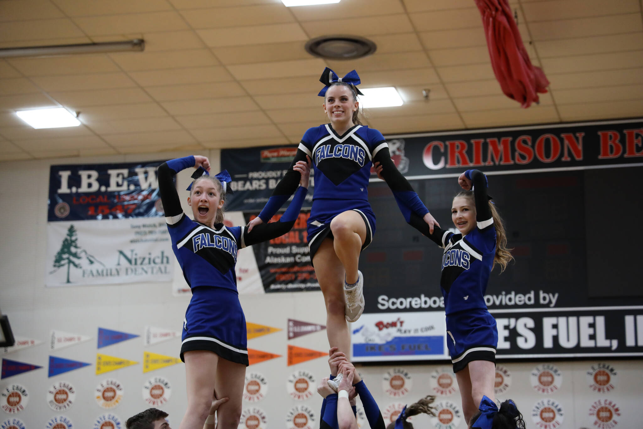 TMHS cheerleaders smile as they balance in the air during the annual Region V 2A/4A dance adjudication competition hosted at Juneau-Douglas High School:Yadaa.at Kalé Saturday afternoon. (Clarise Larson / Juneau Empire)