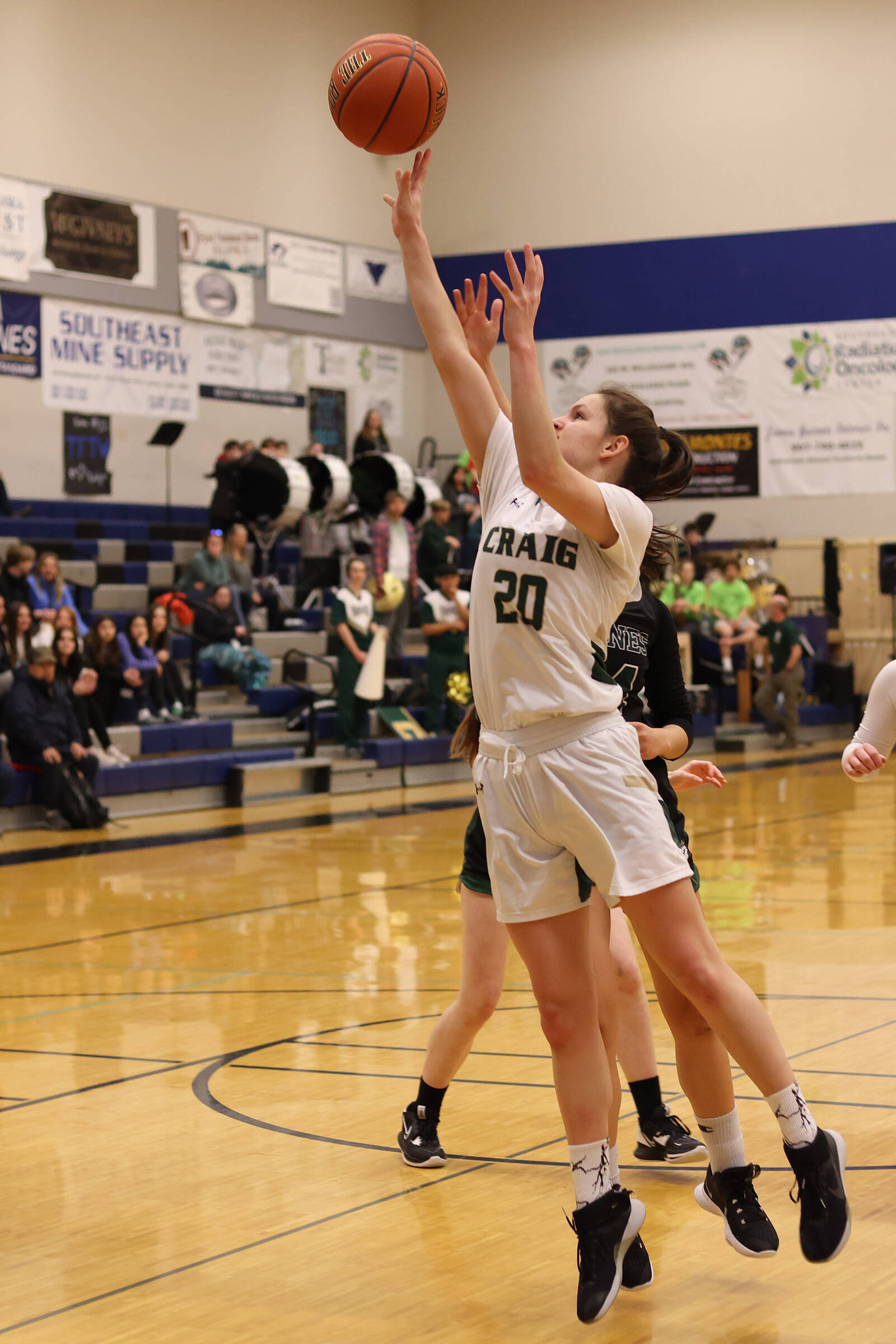Craig senior Laci Lowery (20) shoots early in an elimination game against Haines. (Ben Hohenstatt / Juneau Empire)