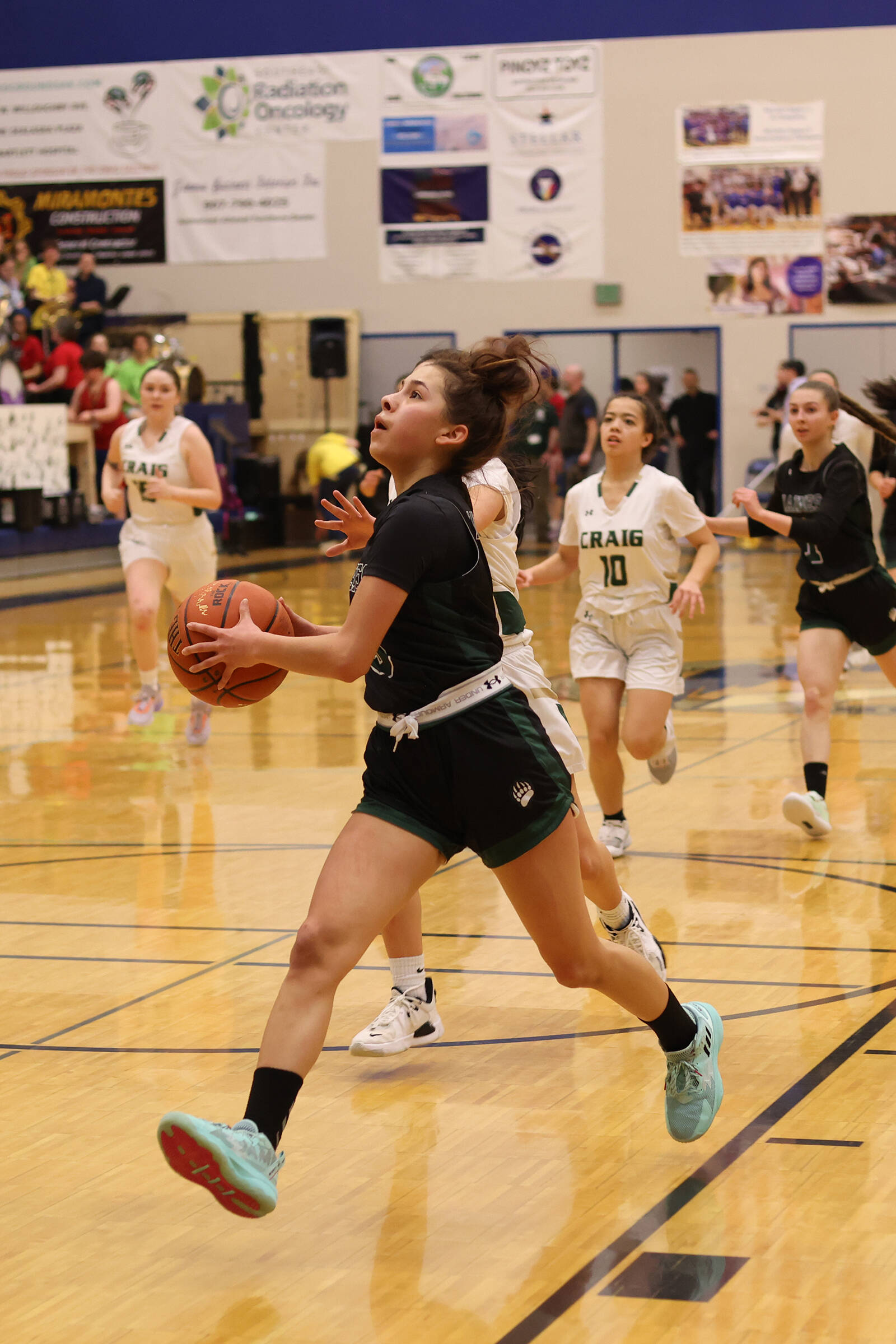 Haines sophomore Ari’el Godinez Long (3) leads the pack down the court on her way to putting 2 points on the board in a game against Craig that secured the Lady Glacier Bears a trip to state. (Ben Hohenstatt / Juneau Empire)