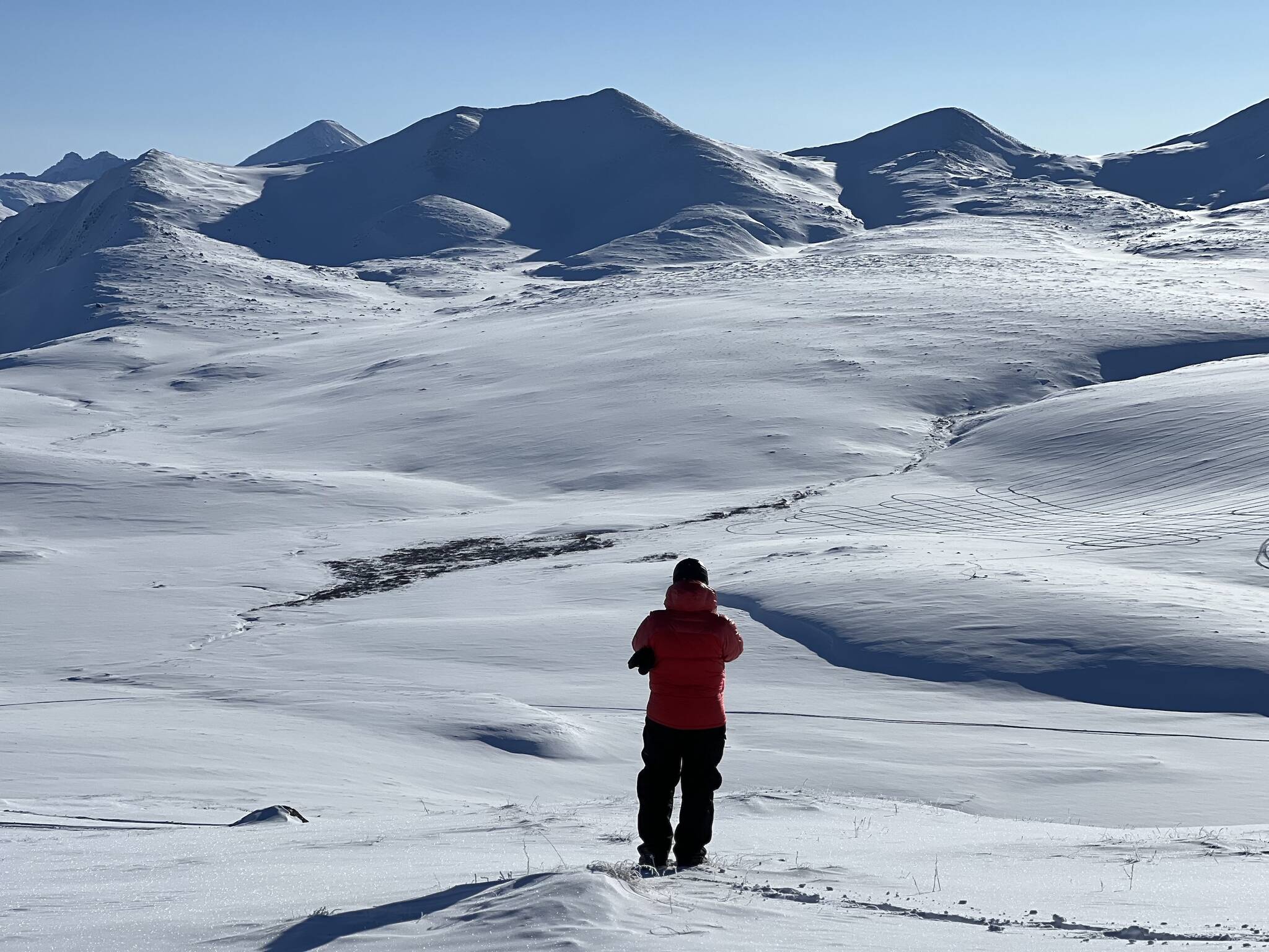 HP Marshall of Boise State University takes a photo of Alaska’s North Slope north of the Brooks Range during a snow survey as part of a NASA experiment. (Courtesy Photo / Sveta Stuefer)