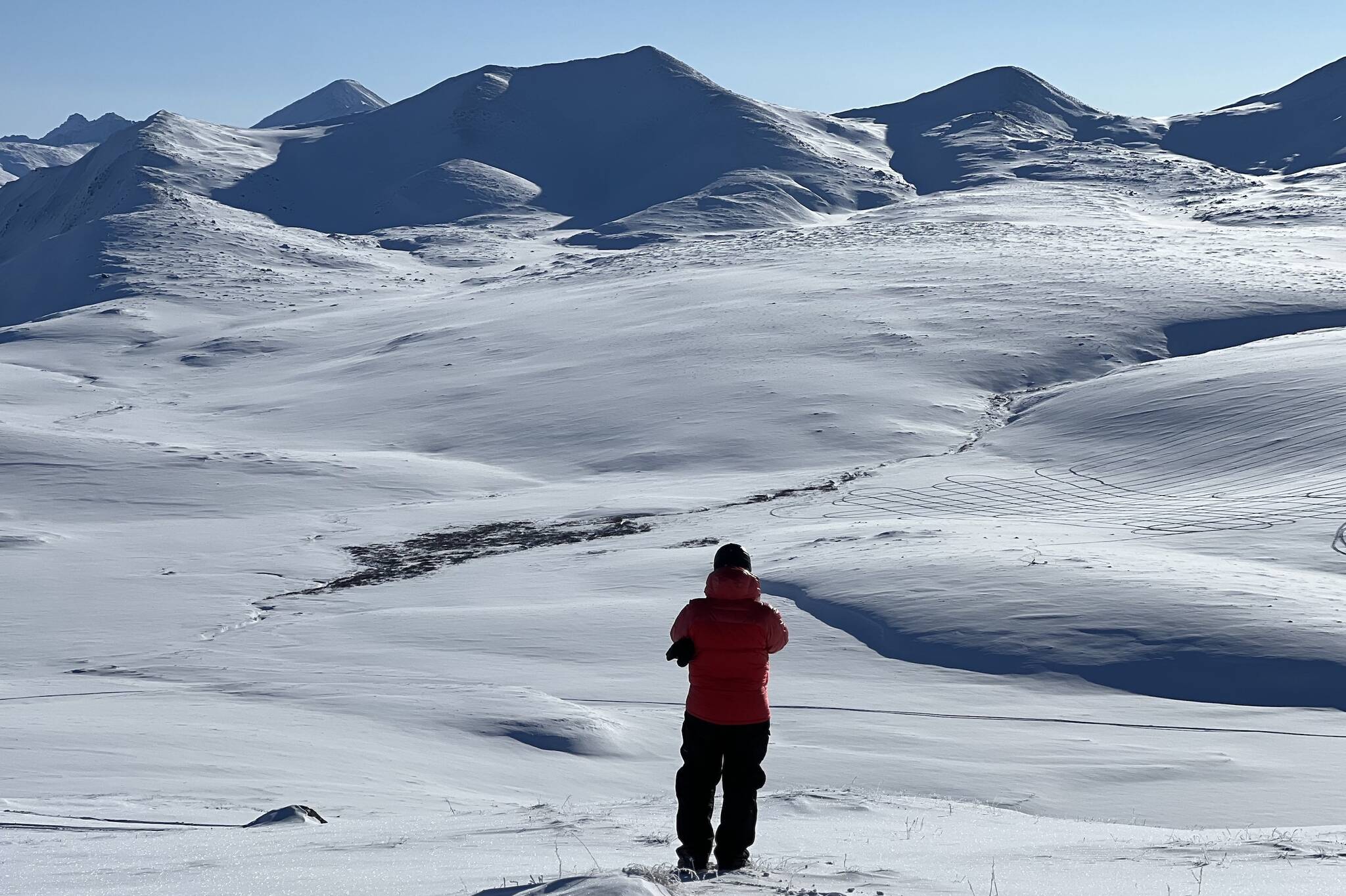 HP Marshall of Boise State University takes a photo of Alaska’s North Slope north of the Brooks Range during a snow survey as part of a NASA experiment. (Courtesy Photo / Sveta Stuefer)