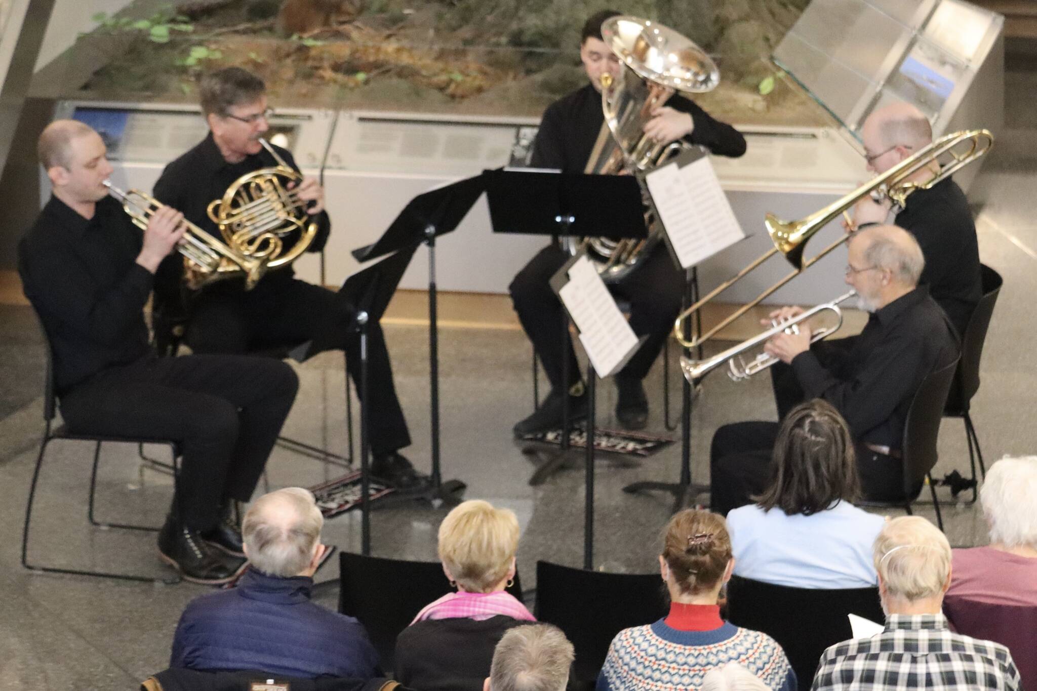 From left to right, Stephen Young, Bill Paulick, Alan Young, Jared Lear and Jack Hodges perform together as the Juneau Brass Quintet on Saturday at the Alaska State Museum for their season-ending show. (Jonson Kuhn / Juneau Empire)