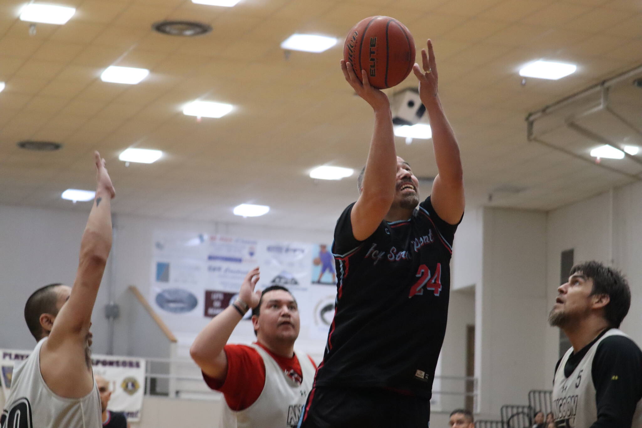 Travis Dybdahl for team Hoonah shoots a layup against Angoon Sunday night during the Gold Medal Basketball Tournament at JDHS. Dybdahl led his team in scores for a total of 32 points (Jonson Kuhn / Juneau Empire)