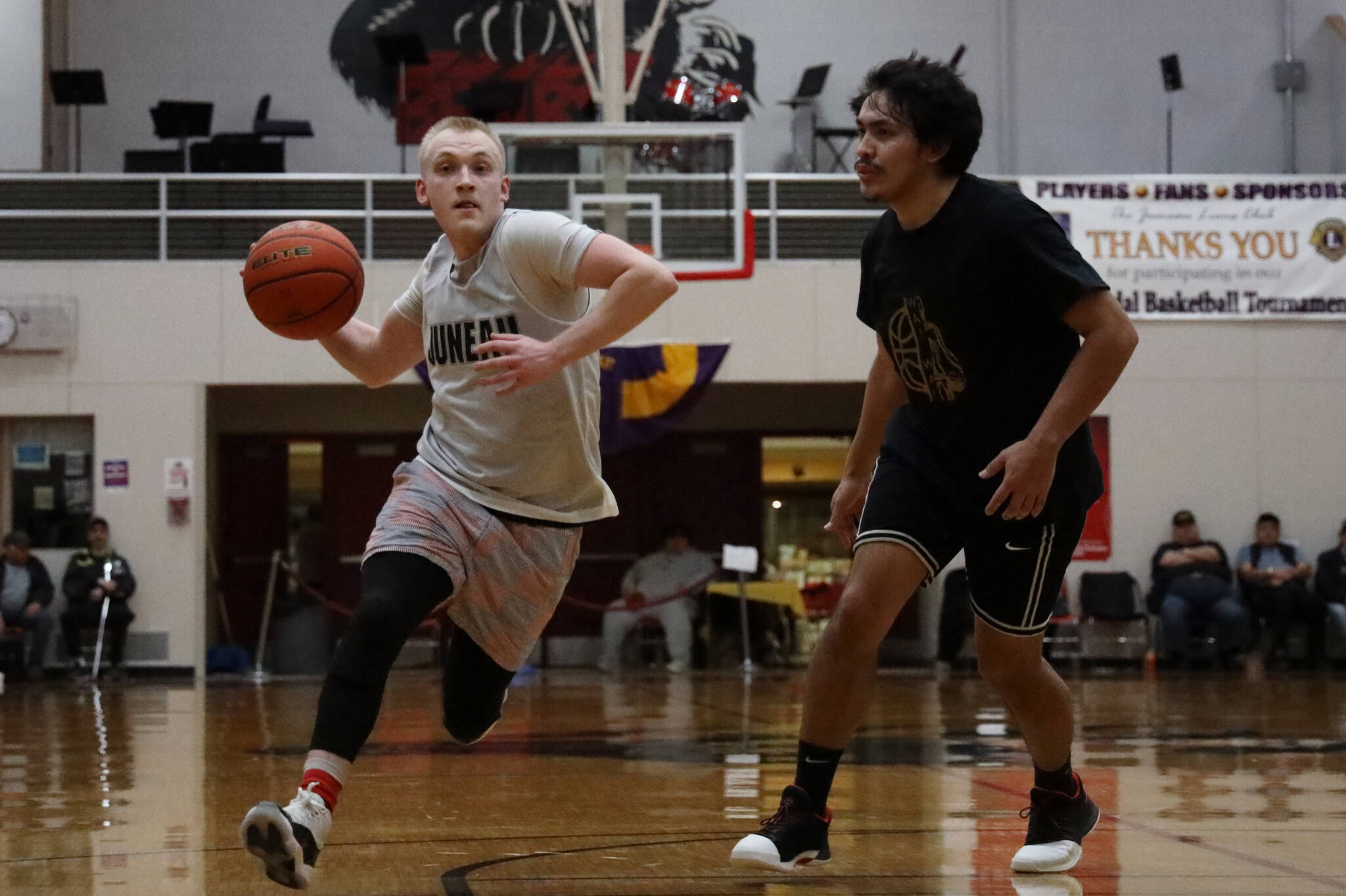 Juneau’s Chase Saviers goes in for a layup Monday afternoon in a B Bracket game against Metlakatla during the Juneau Lions Club 74th Annual Gold Medal Basketball Tournament at the Juneau-Douglas High School: Yadaa.at Kalé gymnasium. (Clarise Larson / Juneau Empire)