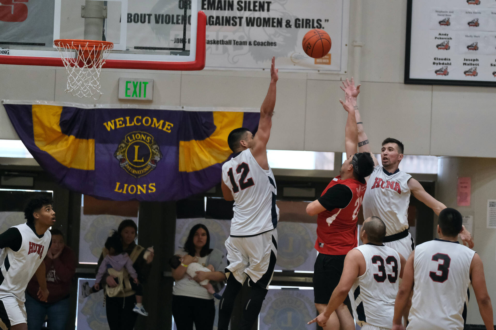 Kake’s Charles Jackson (21) makes the final game-winning shot on Tuesday against Hoonah during overtime to secure Kake’s advancement in this year’s Gold Medal Basketball Tournament. (Klas Slope / For the Juneau Empire)