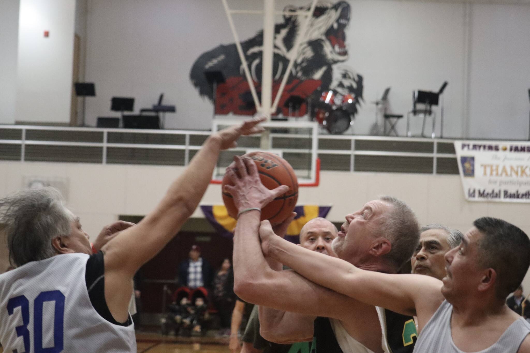 Sitka’s Norm Staton (32) fights for the rebound against Kake on Wednesday during an elimination game for the M Bracket in this year’s Gold Medal basketball tournament. Staton finished the game with 6 points. (Jonson Kuhn / Juneau Empire)