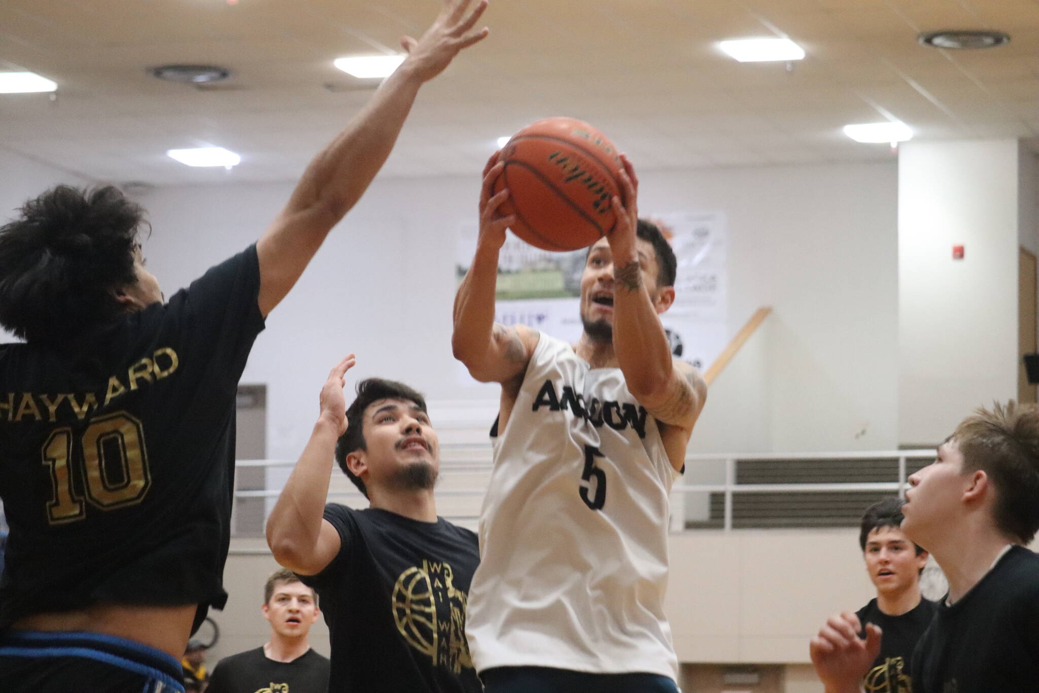 Angoon’s Aquino Brinson (5) drives the ball in for a layup on Wednesday against Metlakatla for a B bracket elimination game in this year’s Gold Medal basketball game. Brinson ended the game with a total of 25 points. (Jonson Kuhn / Juneau Empire)