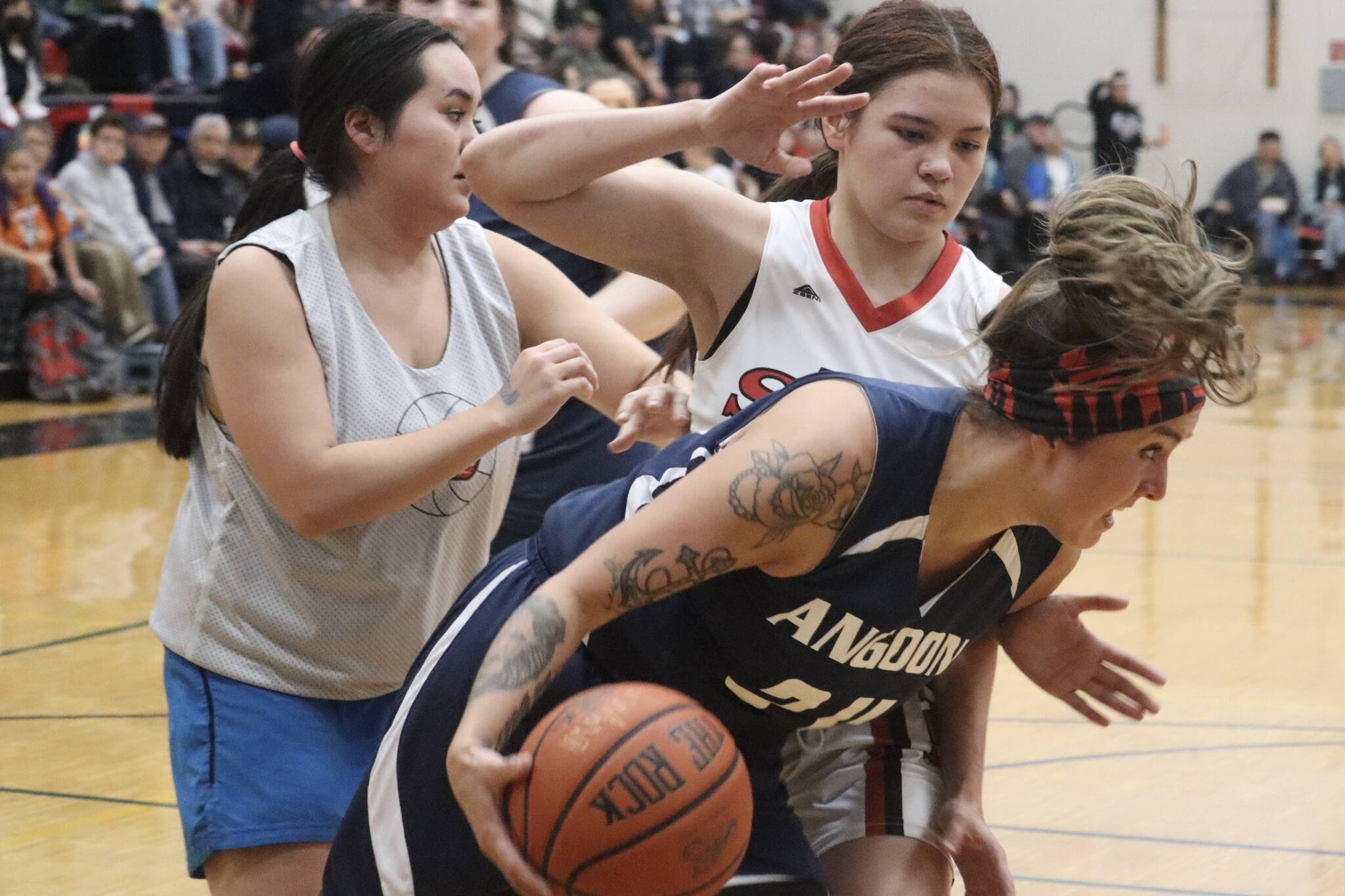 Angoon’s Ladonna Byers fights for the rebound against Hoonah on Wednesday night for an elimination game in the W bracket for this year’s Gold Medal basketball tournament. Byers would finish the game with 11 points. (Jonson Kuhn / Juneau Empire)
