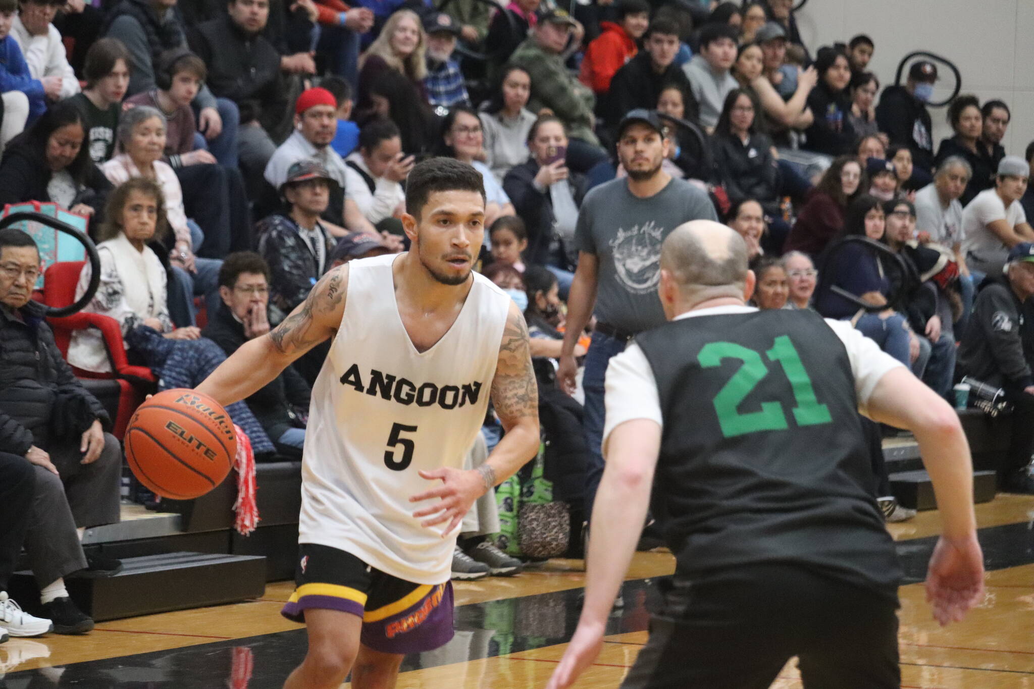 Angoon’s Aquino Brinson looks for an open pass against Haines on Thursday for an elimination game inside the B bracket for this year’s Gold Medal basketball tournament. Brinson finished the game with a total of 10 points. (Jonson Kuhn / Juneau Empire)