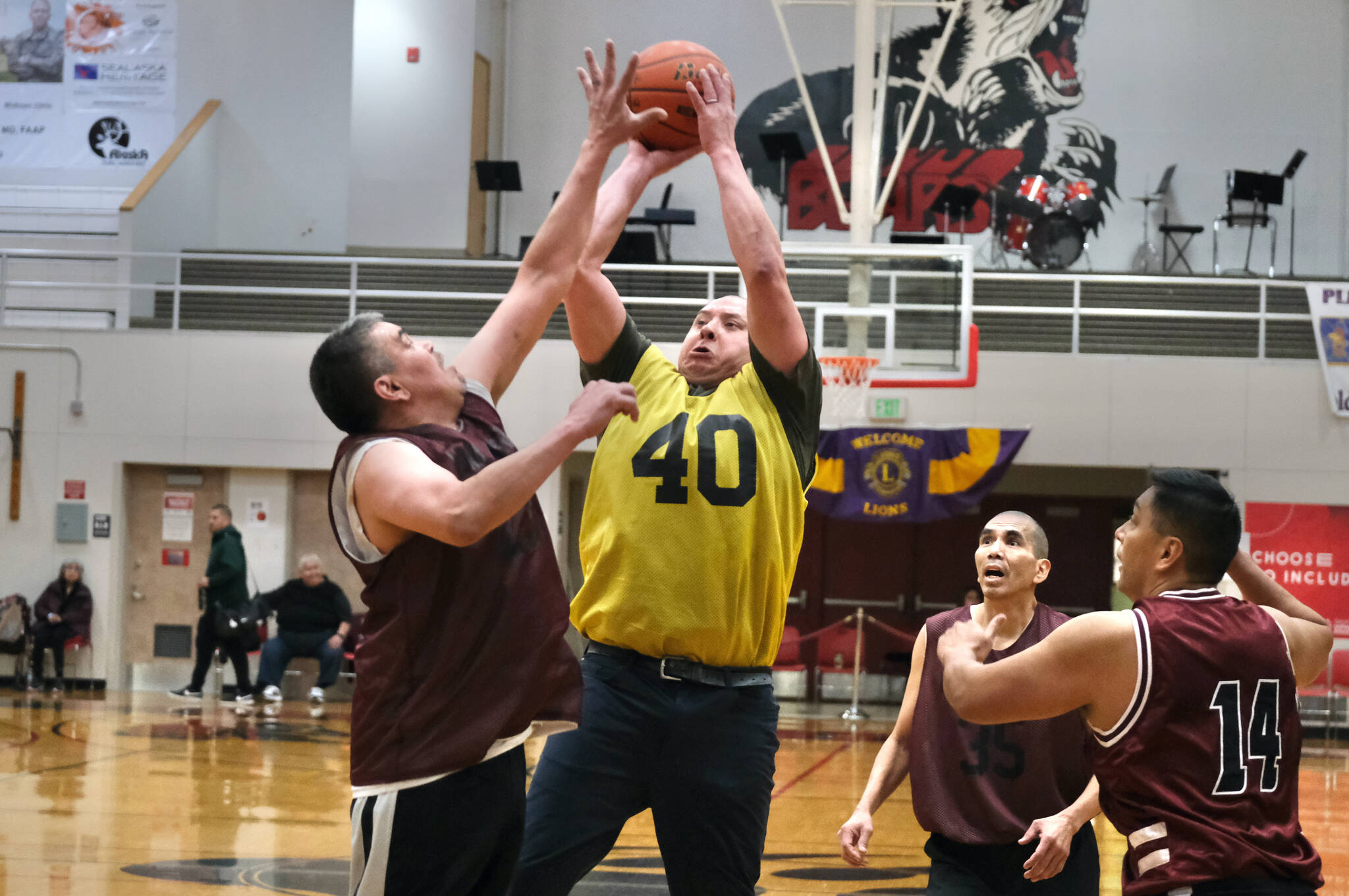 Hoonah’s Albert Hinchman defends as hot by Sitka’s Patrick Miller (40) as Hoonah’s Andy Gray, Louie White Jr. and Joe Coronell look on during Thursday action at the Juneau Lions Club 74th Gold Medal Basketball Tournament at Juneau-Douglas High School: Yadaa.at Kalé. (Klas Stolpe/For the Juneau Empire)
