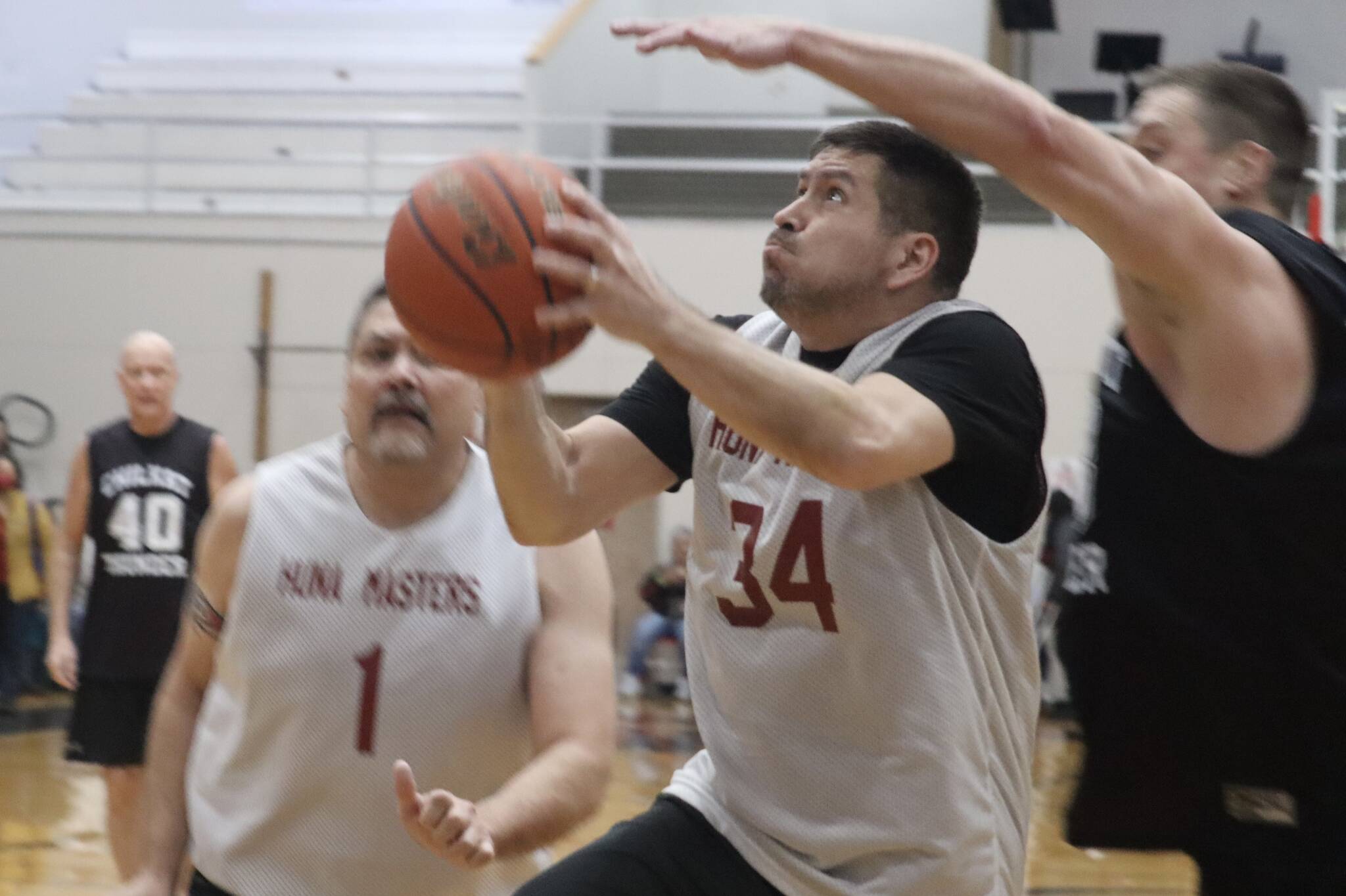 Hoonahs Kamal Lindoff (34) knocks down a layup on Friday against Klukwan in the M bracket Gold Medal Basketball Tournament at JDHS. Lindoff finished the game with 12 points. (Jonson Kuhn / Juneau Empire)