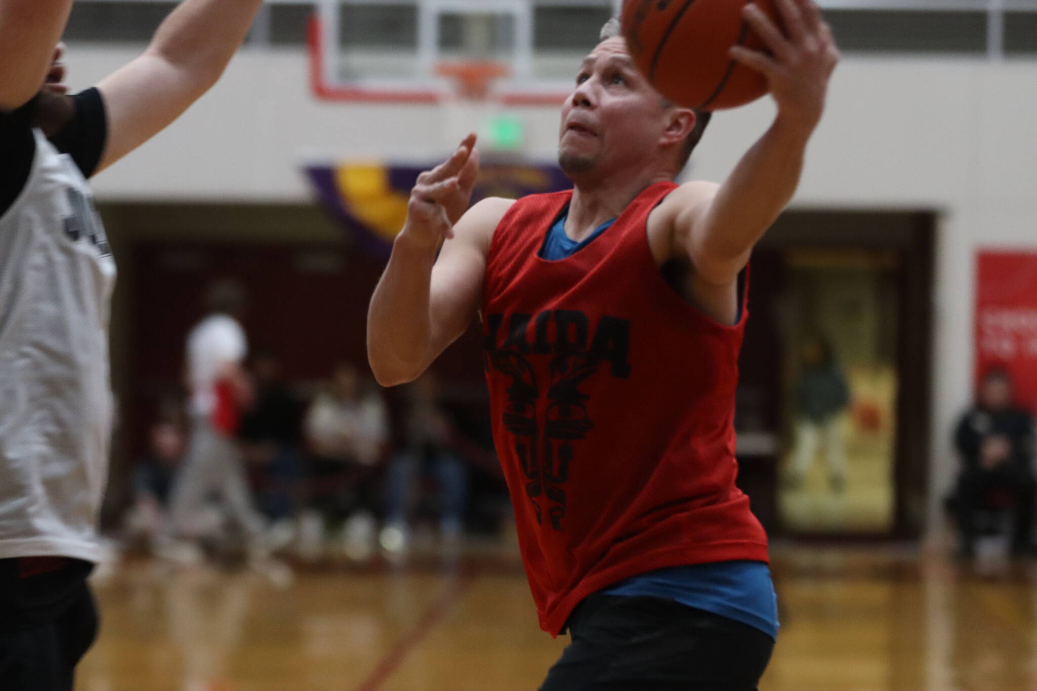 Hydaburg’s Vinny Edenshaw runs in for a layup against Juneau in the B bracket championship game in the Gold Medal Basketball Tournament on Saturday. Edenshaw led his team in scoring for a total of 24 points and earned All-Tournament honors, as well. (Jonson Kuhn / Juneau Empire)