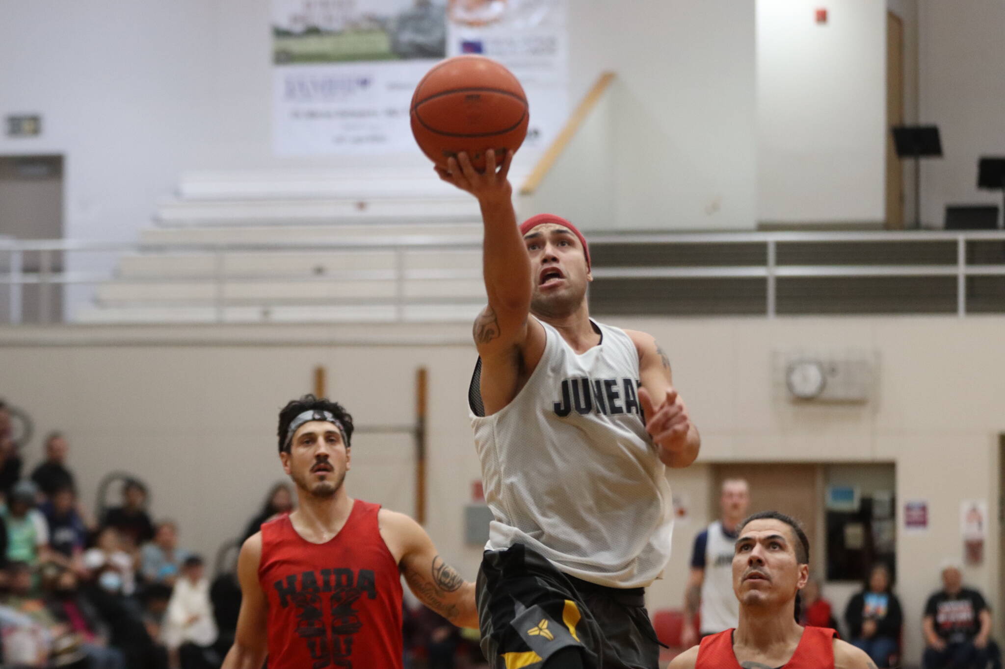 Juneau’s Terrence Wheat takes the ball to the basket for 2 points Saturday night against Hydaburg in the B bracket championship game for this year’s Gold Medal Basketball Tournament at JDHS. Wheat finished the game with 5 points. (Jonson Kuhn / Juneau Empire)
