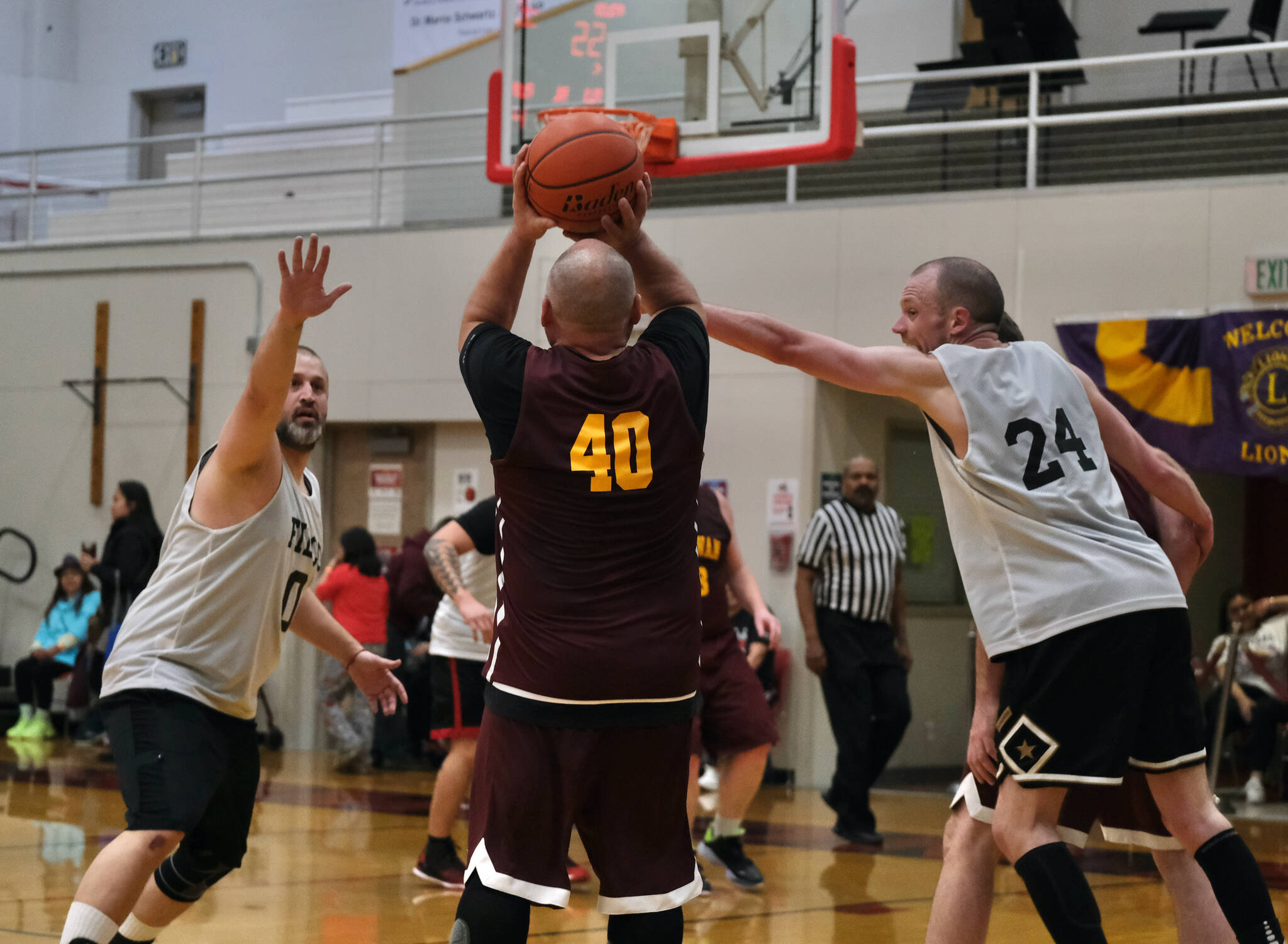 Klukwan’s Stuart Dewitt (40) shoots under pressure from Filcom’s Ray Zimmer (0) and Alex Heumann (24) during the C Bracket Championship at the Gold Medal Basketball Tournament, Saturday, March 25, at Juneau-Douglas High School: Yadaa.at Kalé. (Klas Stolpe/For the Juneau Empire)
