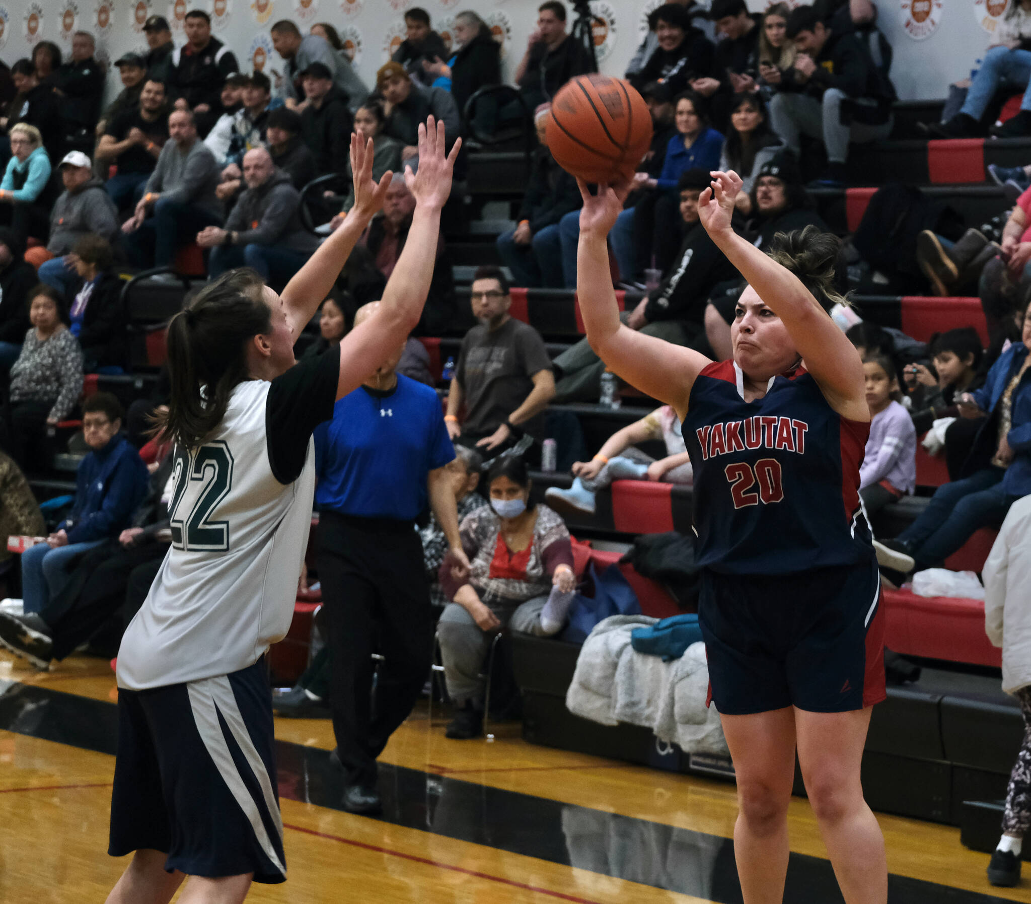 Yakutat’s Rose Fraker (20) shoots over POW’s Nani Weimer (22) during the Gold Medal Basketball Tournament, Saturday, March 25, at Juneau-Douglas High School: Yadaa.at Kalé. (Klas Stolpe/For the Juneau Empire)