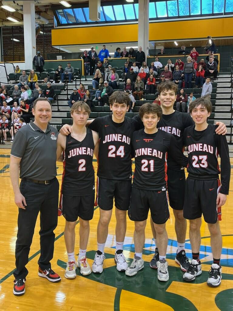 JDHS senior boys with coach Robert Casperson, left to right, Nelson Bodhi, Kai Hargrave, Caden Masdeg, Orion Dybdahl and Joseph Aline, pose for a photo at the ASAA state competition in Anchorage on Saturday before the championship game against Dimond High School. The Crimson Bears would take sixth place overall. (Courtesy Photo / Robert Casperson)