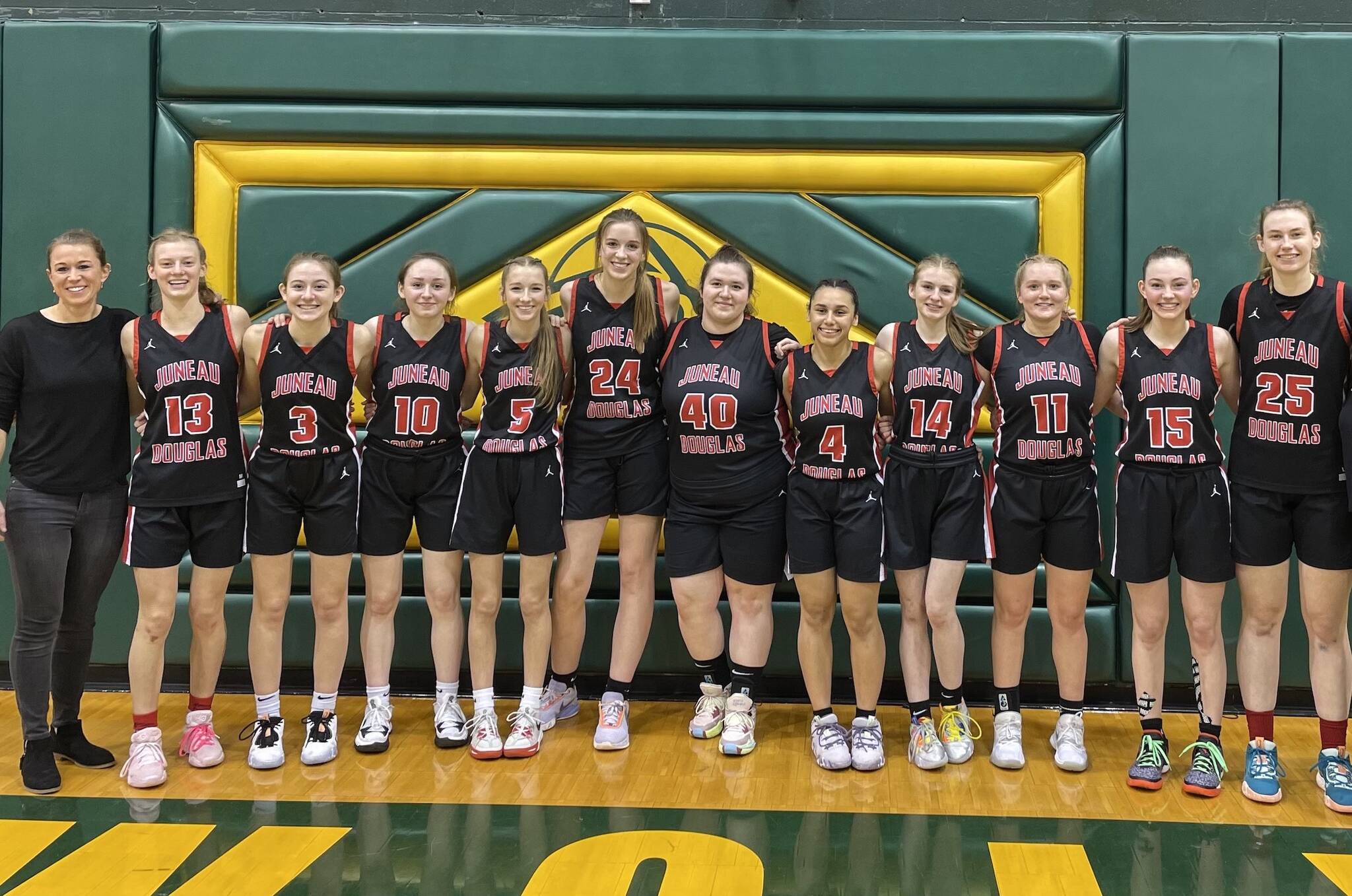 The 2022-2023 JDHS Crimson Bears pose for a photo at ASAA state competition in Anchorage on Saturday before competing against TMHS in the championship game. JDHS finished in fourth place and TMHS went home in sixth. (Courtesy Photo / Tanya Nizich)