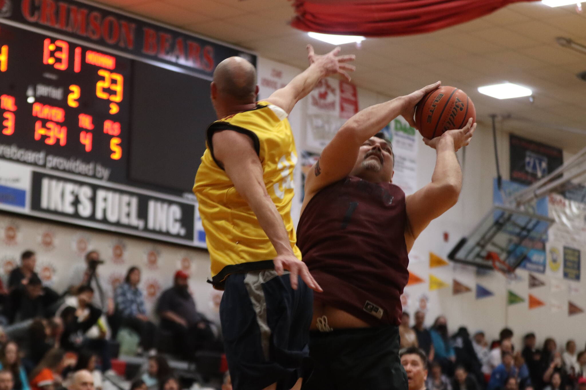 Hoonah’s Michael Mills (1) fights for the rebound against Juneau on Saturday during the championship M bracket game for the 2023 Gold Medal Basketball Tournament. Mills finished the game with 8 points