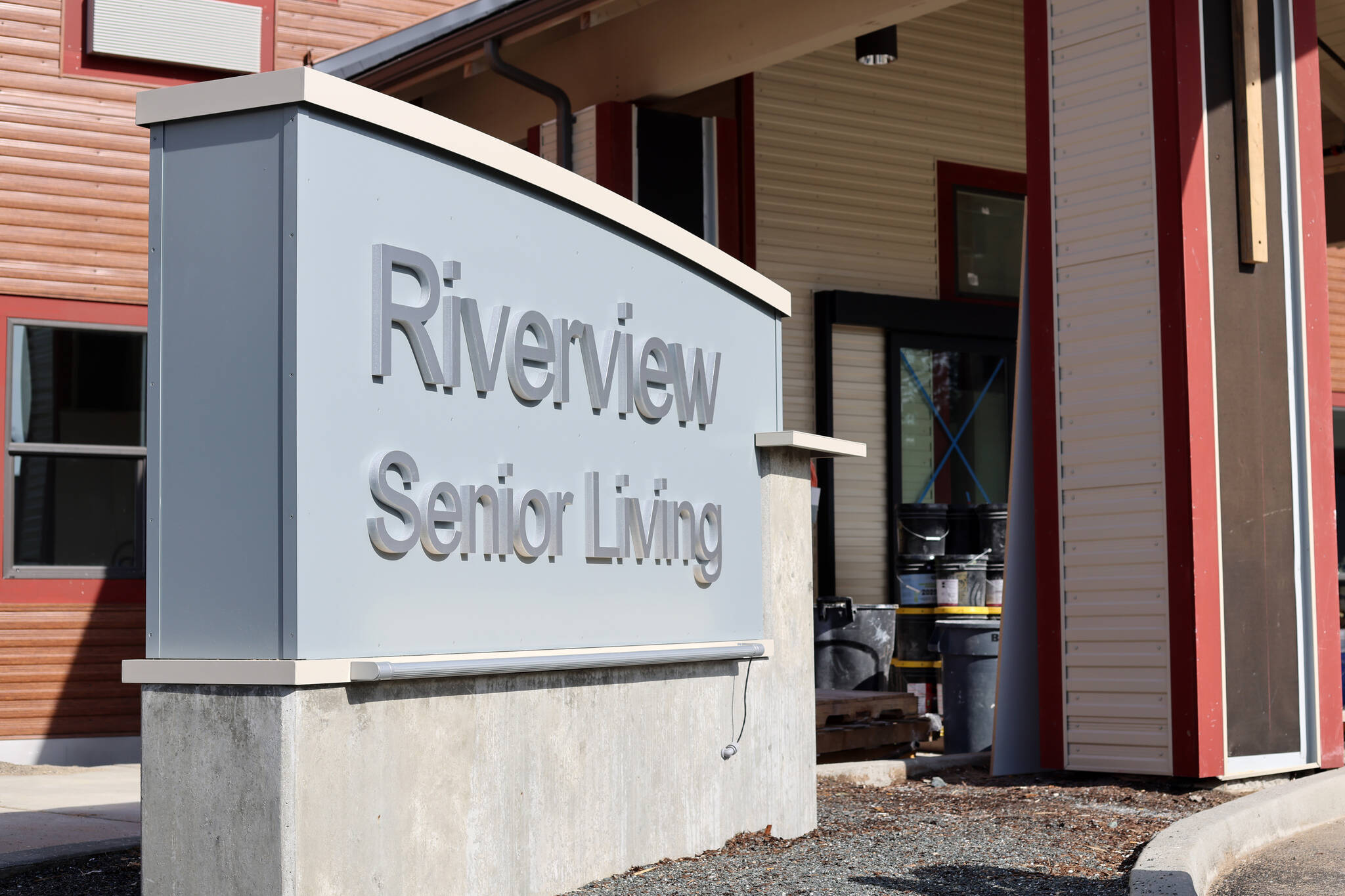 Sun shines on a sign outside of Riverview Senior Living, an assisted-living community expected to welcome move-ins in early May. Ahead of that, a public event featuring Riverview’s team of directors will be held Saturday at the Baranof Dowtnown. (Ben Hohenstatt / Juneau Empire)