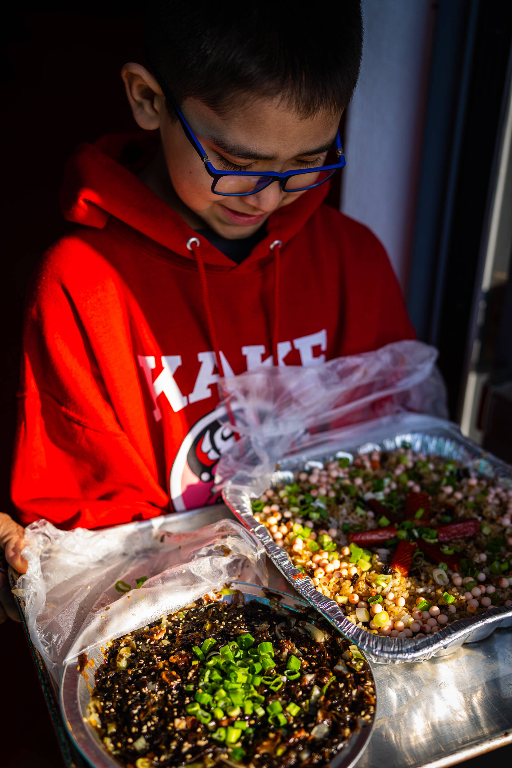 Community members of all ages brought an array of homemade foods with wild ingredients like black seaweed, smoked salmon, salmon eggs and cloudberries to enter the food competition. (Courtesy Photo / Bethany Goodrich)