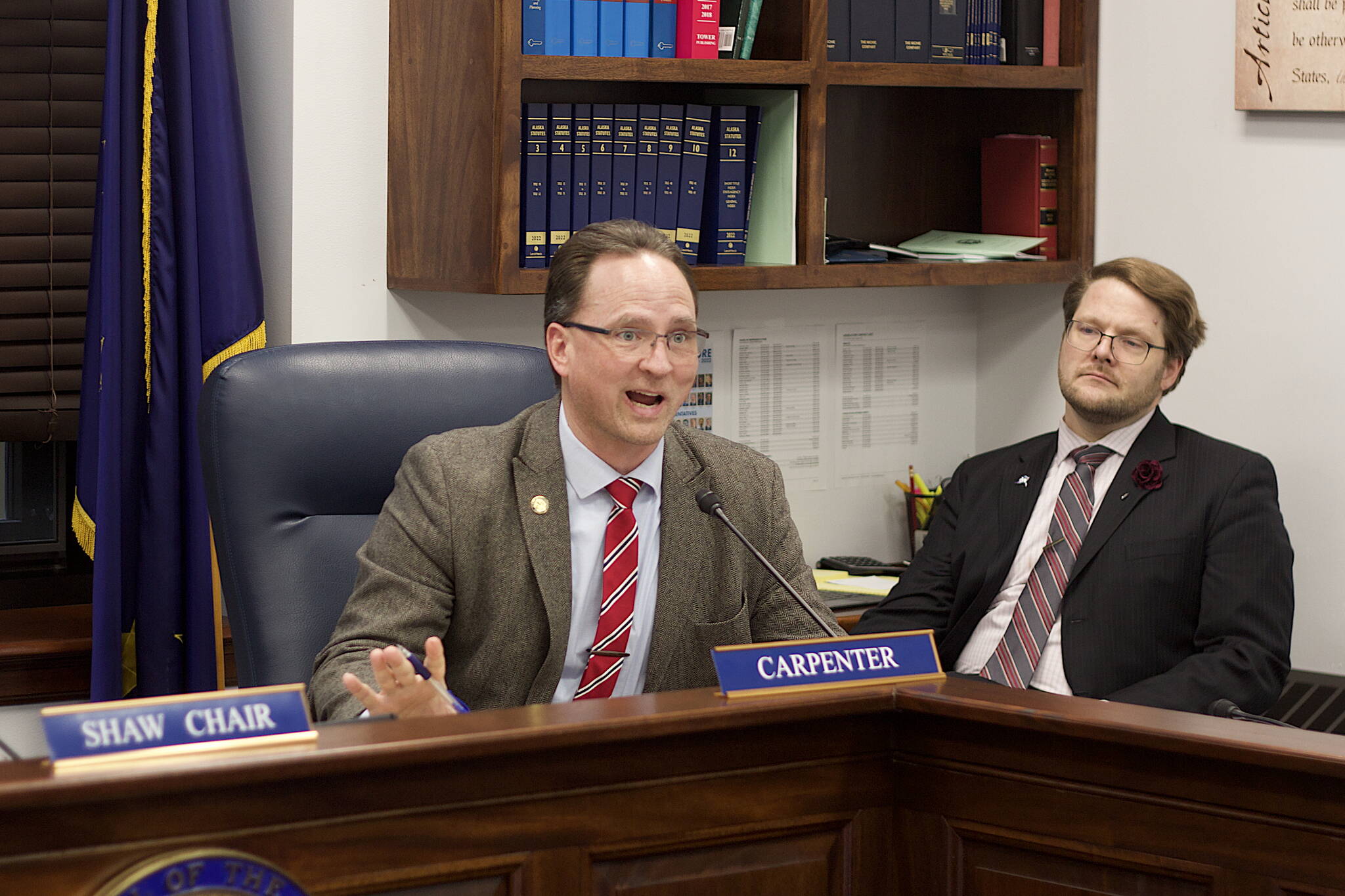 State Rep. Ben Carpenter, R-Nikiski, inquires about election legislation during a committee hearing Tuesday at the Alaska State Capitol. Carpenter, chair of the House Ways and Means Committee, is sponsoring bills to decrease business taxes and implement a 2% statewide sales tax that got hearings this week. (Mark Sabbatini / Juneau Empire)