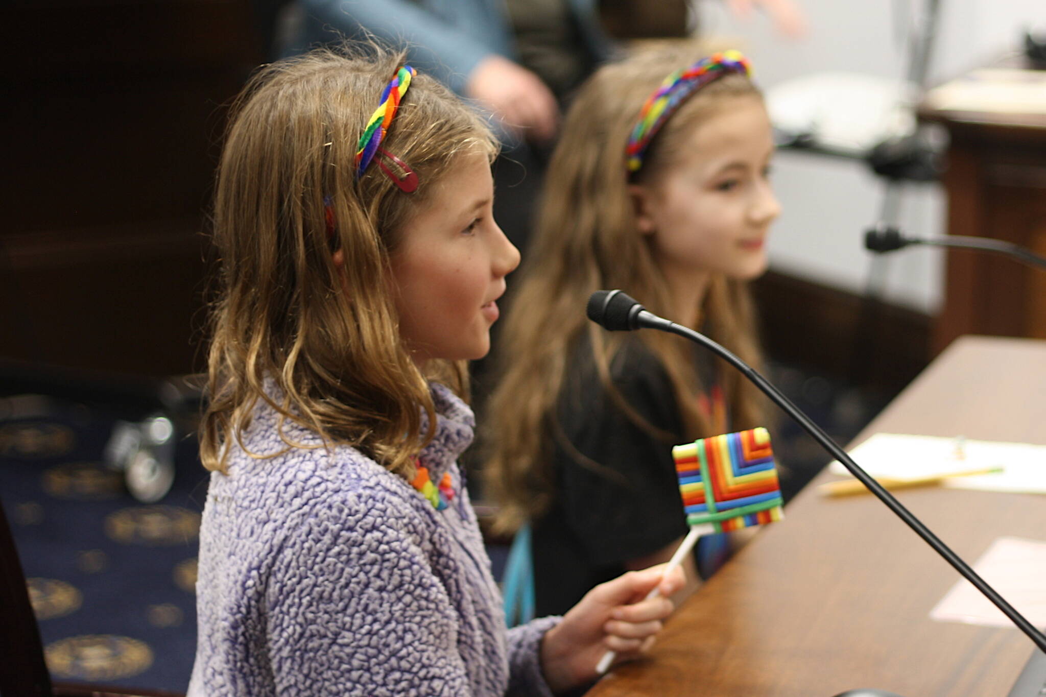 Mark Sabbatini / Juneau Empire 
Nayeli Hood, 10, foreground, and Ona Eckerson, 9, testify against a bill limiting sex and gender content in schools during a House Education Committee meeting Thursday night.