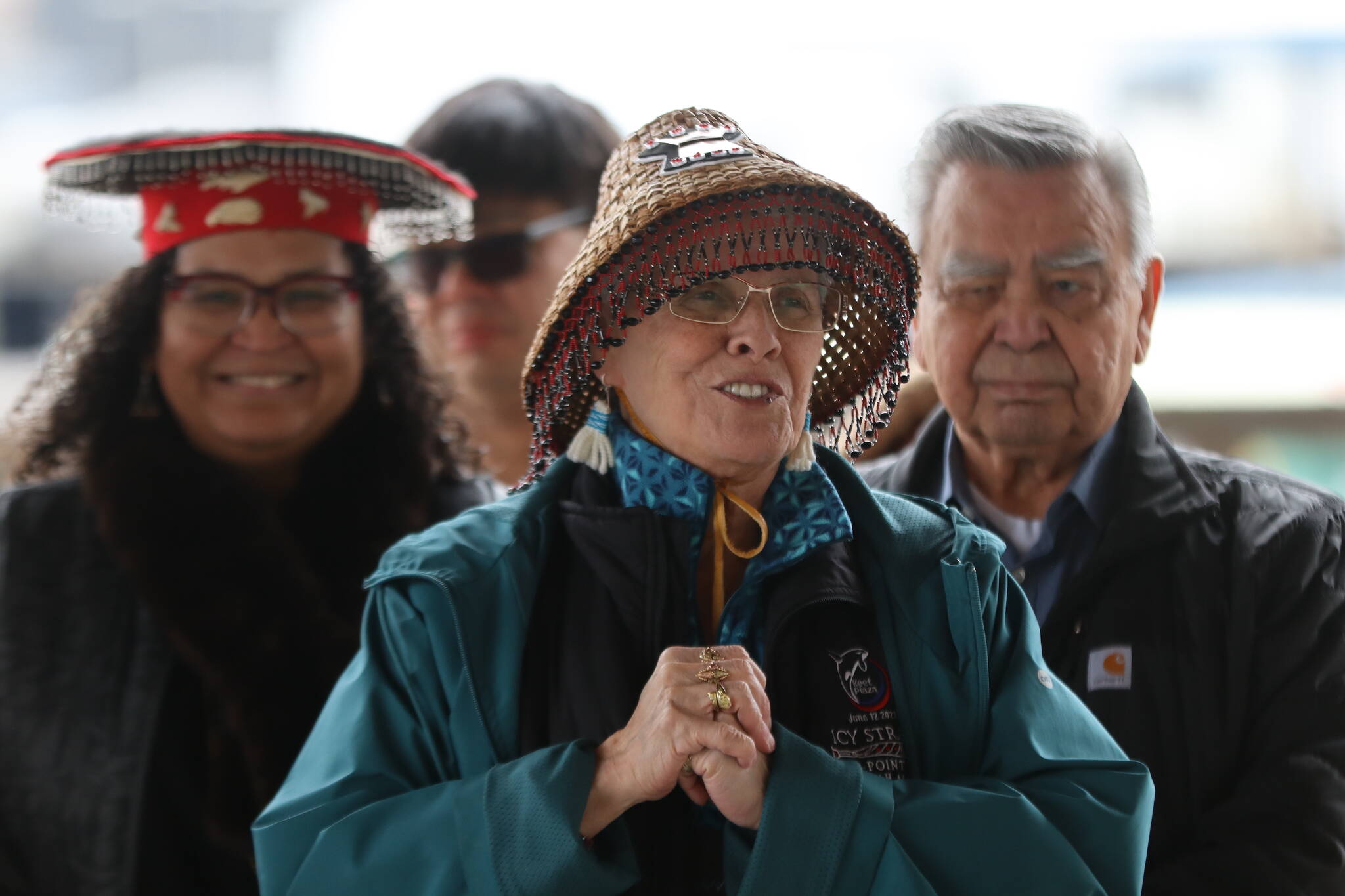 Áakʼw Ḵwáan spokesperson Fran Houston addresses a crowd of people during a blessing ceremony on Friday at Marine Park as part of the Kootéeyaa Deiyí (Totem Pole Trail) that will run along the downtown Juneau waterfront. (Jonson Kuhn / Juneau Empire)
