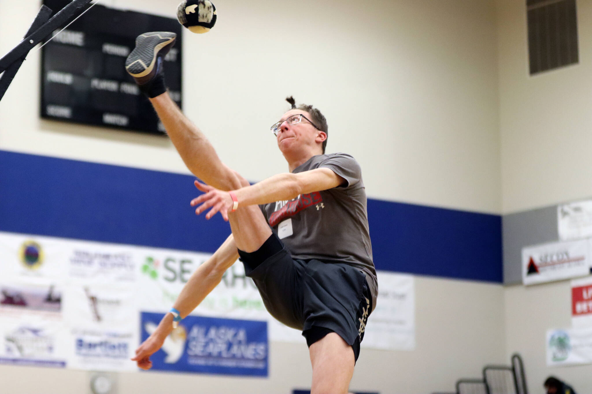 Photos by Jonson Kuhn / Juneau Empire 
Caleb Evans of team Homer Halibuts tries his best at the one-foot high kick competition during the sixth annual Traditional Games on Saturday at Thunder Mountain High School.