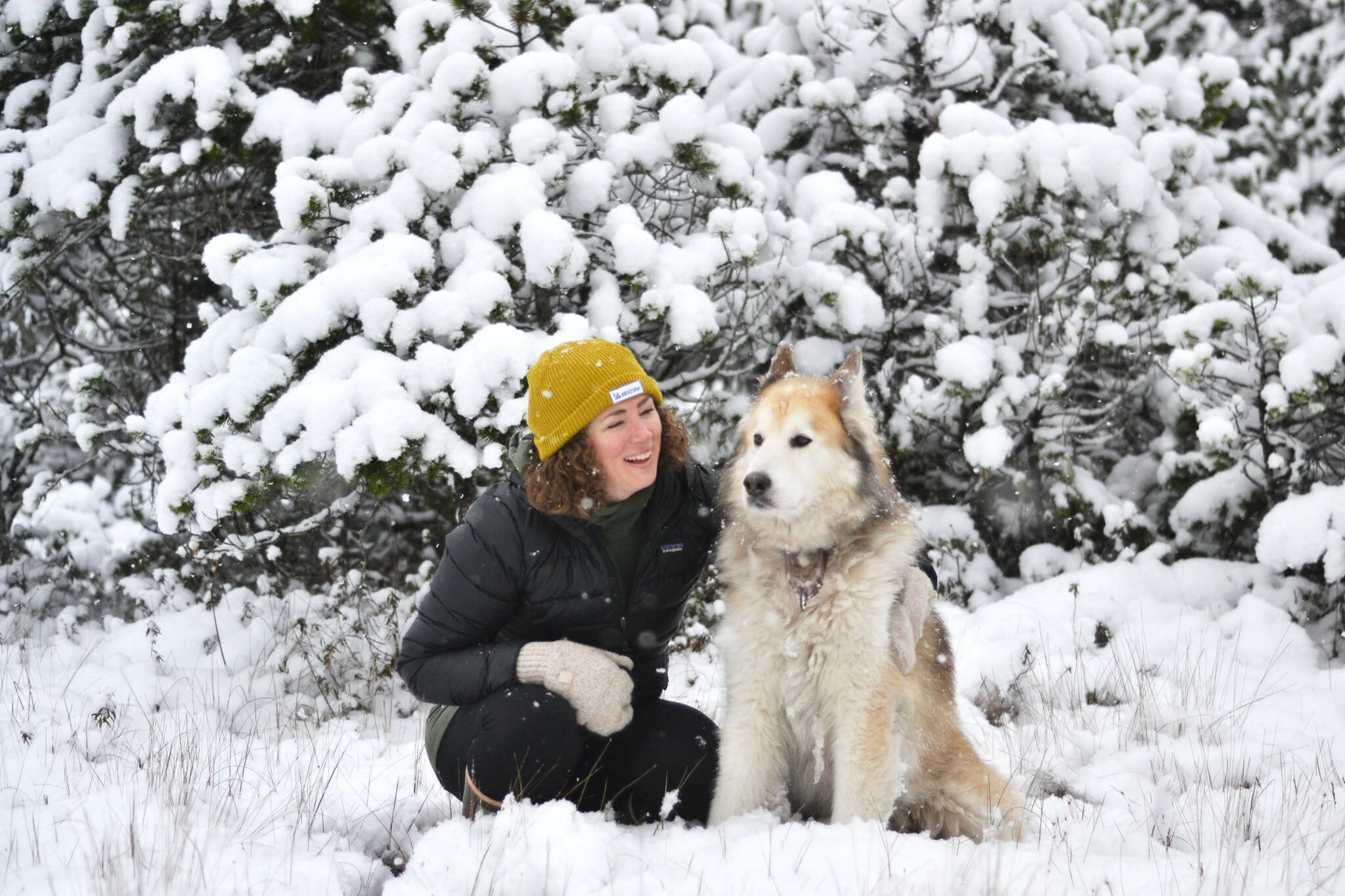 Angie Flickinger and Togiak in the forest in Wrangell. (Courtesy Photo / Alex Freericks)